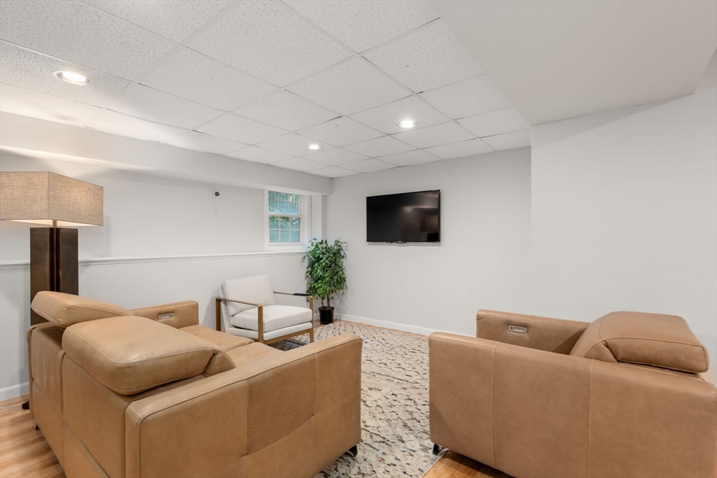 15 Broad Acres Farm Road Medway, MA 02053 - Photo 31 of 42 a living room with furniture and a flat screen tv