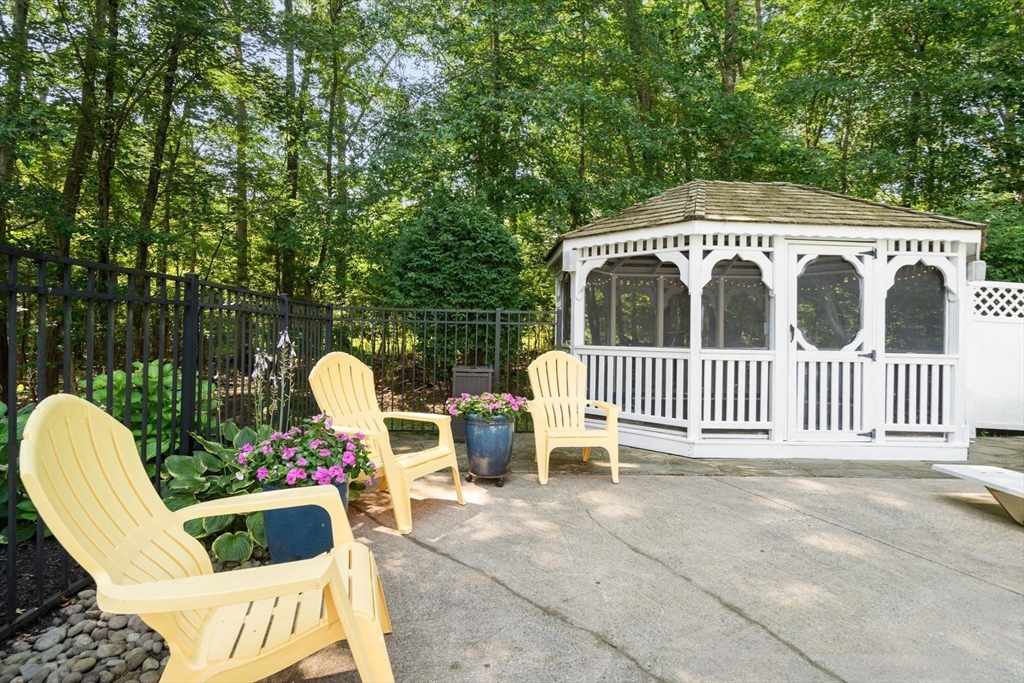 15 Broad Acres Farm Road Medway, MA 02053 - Photo 38 of 42 a view of a chair and tables