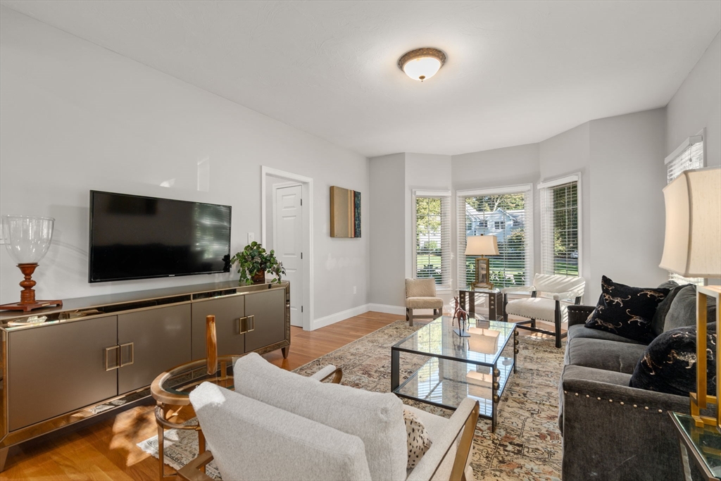15 Broad Acres Farm Road Medway, MA 02053 - Photo 6 of 42 a living room with furniture and a flat screen tv