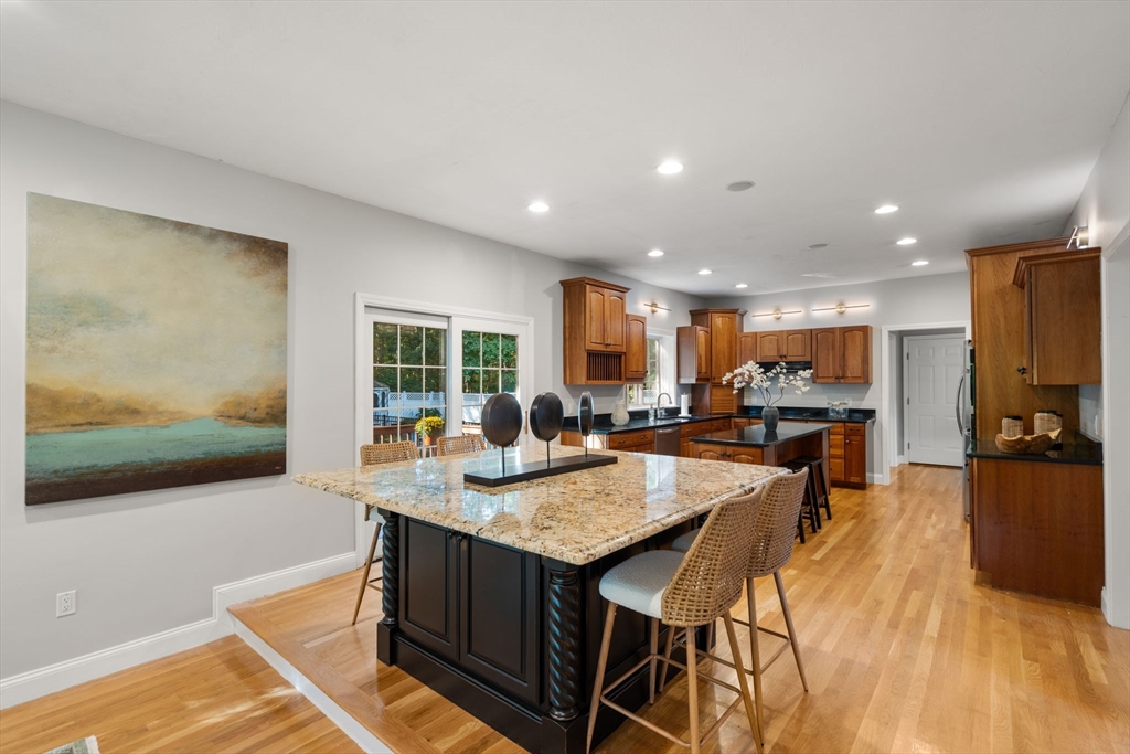 15 Broad Acres Farm Road Medway, MA 02053 - Photo 10 of 42 a living room with stainless steel appliances granite countertop furniture and a flat screen tv