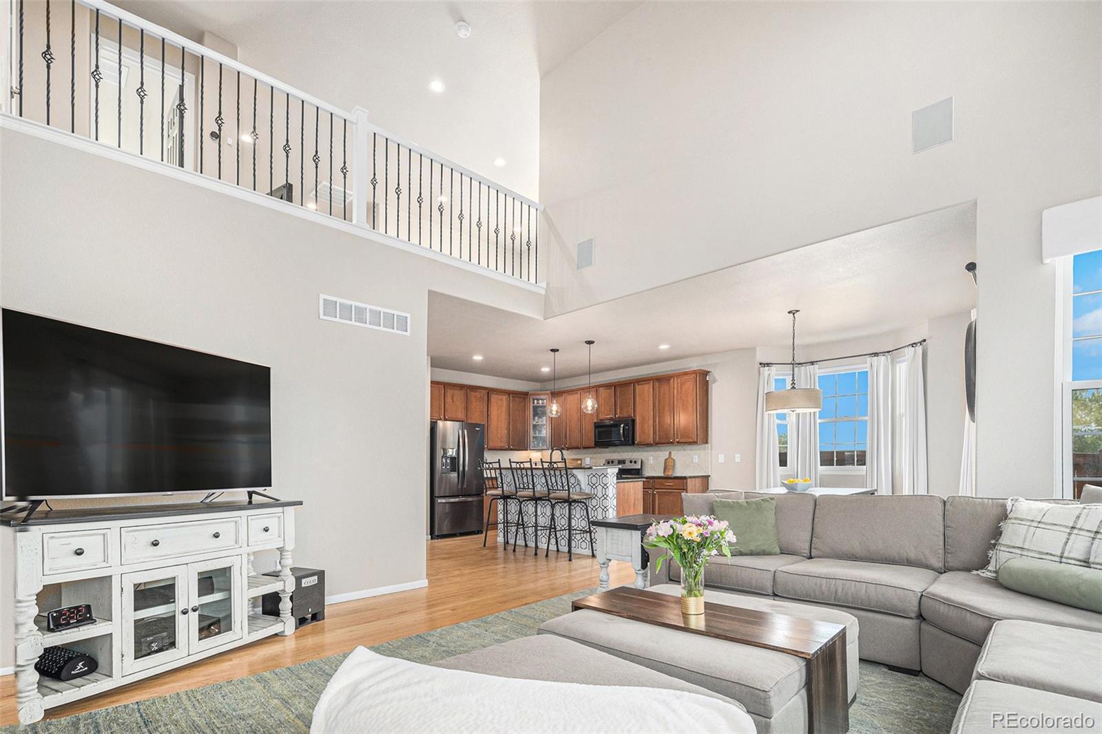 2470 Robindale Way Castle Rock, CO 80109 - Photo 11 of 42 a living room with furniture and a flat screen tv