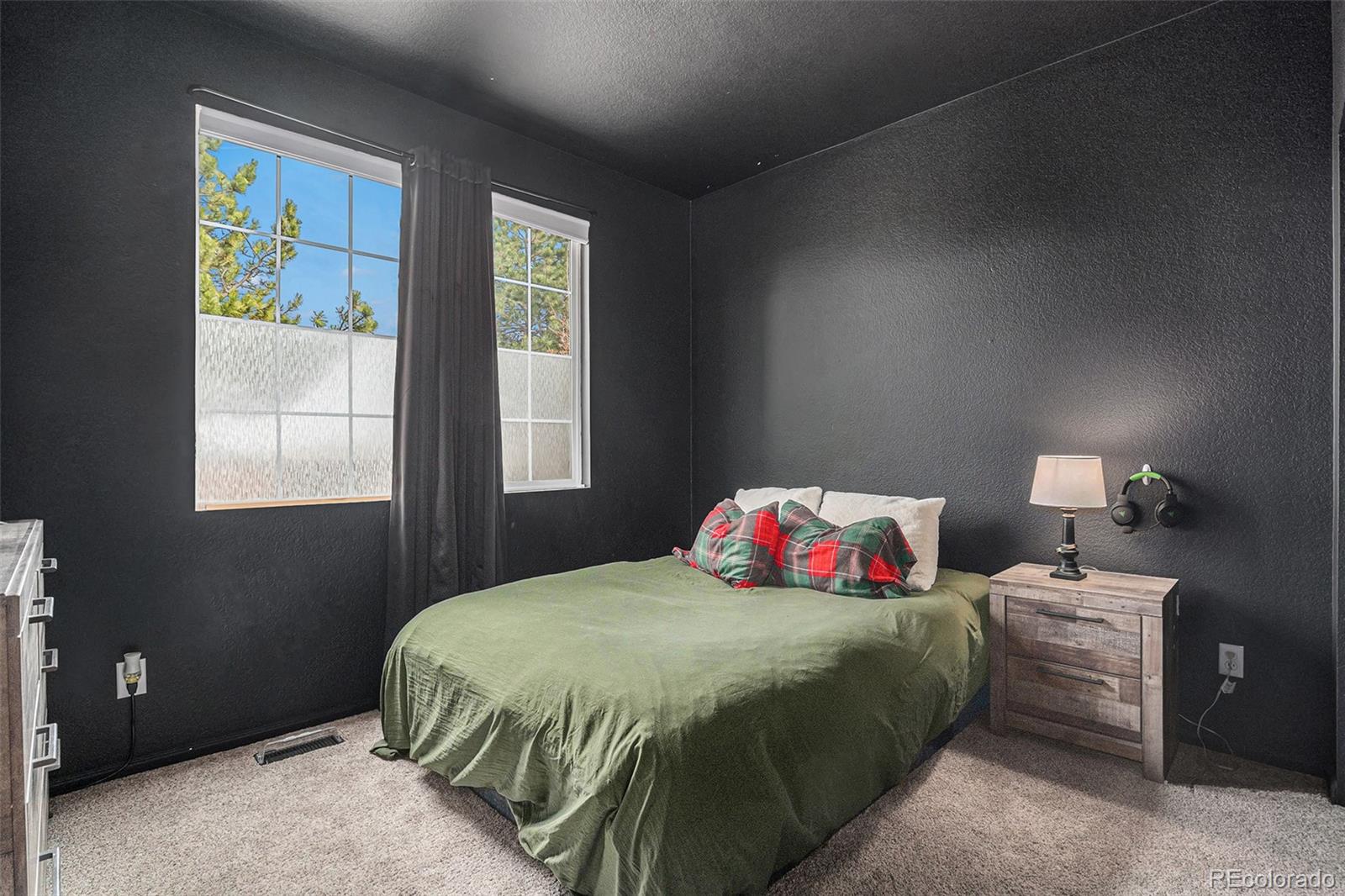 2470 Robindale Way Castle Rock, CO 80109 - Photo 15 of 42 a bedroom with a bed and window