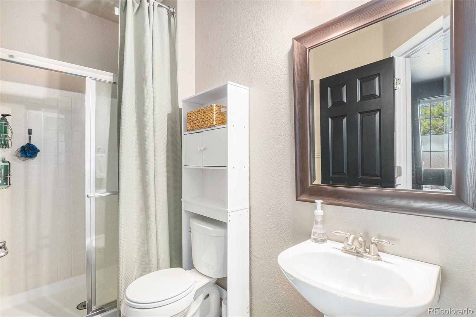 2470 Robindale Way Castle Rock, CO 80109 - Photo 16 of 42 a bathroom with a sink a toilet and shower