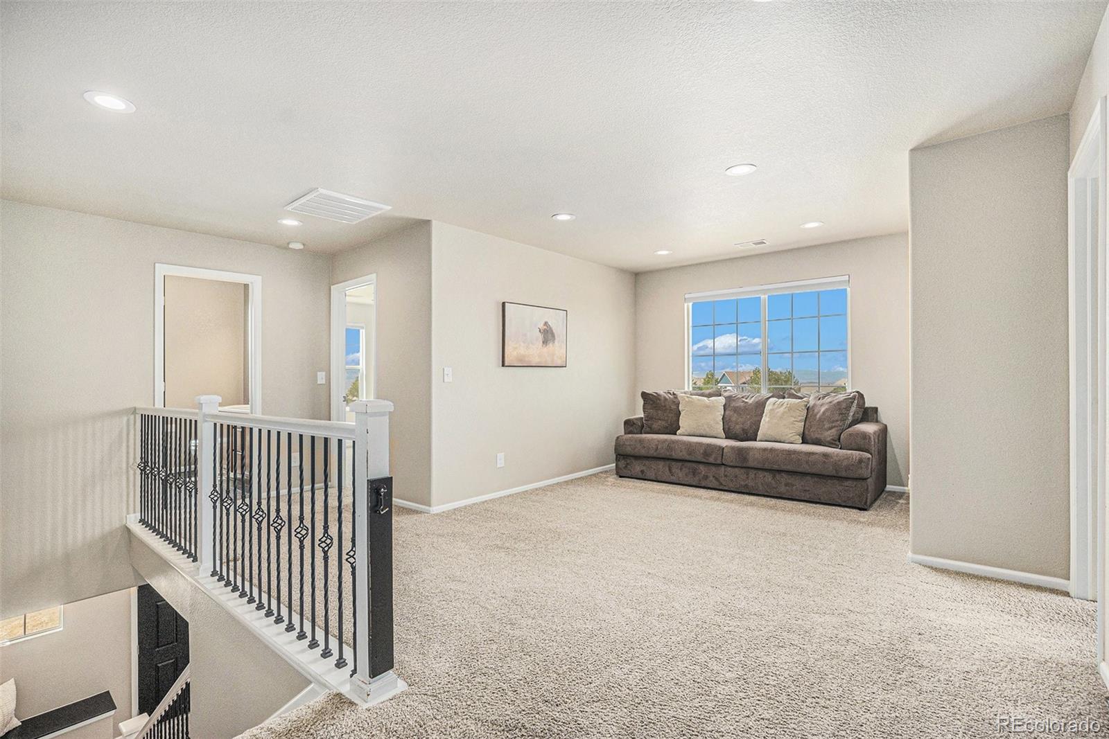 2470 Robindale Way Castle Rock, CO 80109 - Photo 20 of 42 a living room with furniture and a table