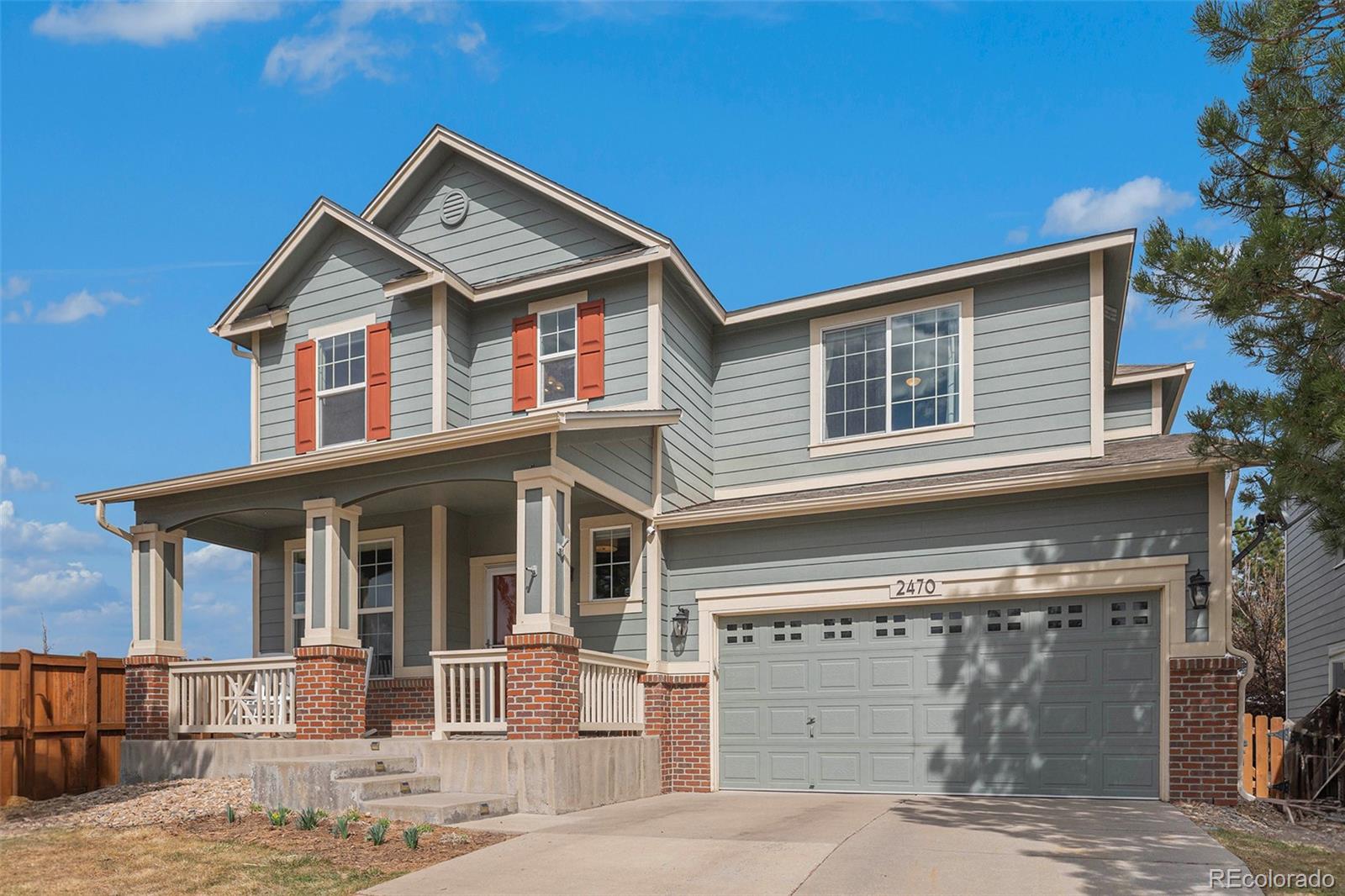 2470 Robindale Way Castle Rock, CO 80109 - Photo 2 of 42 a front view of a house with a yard