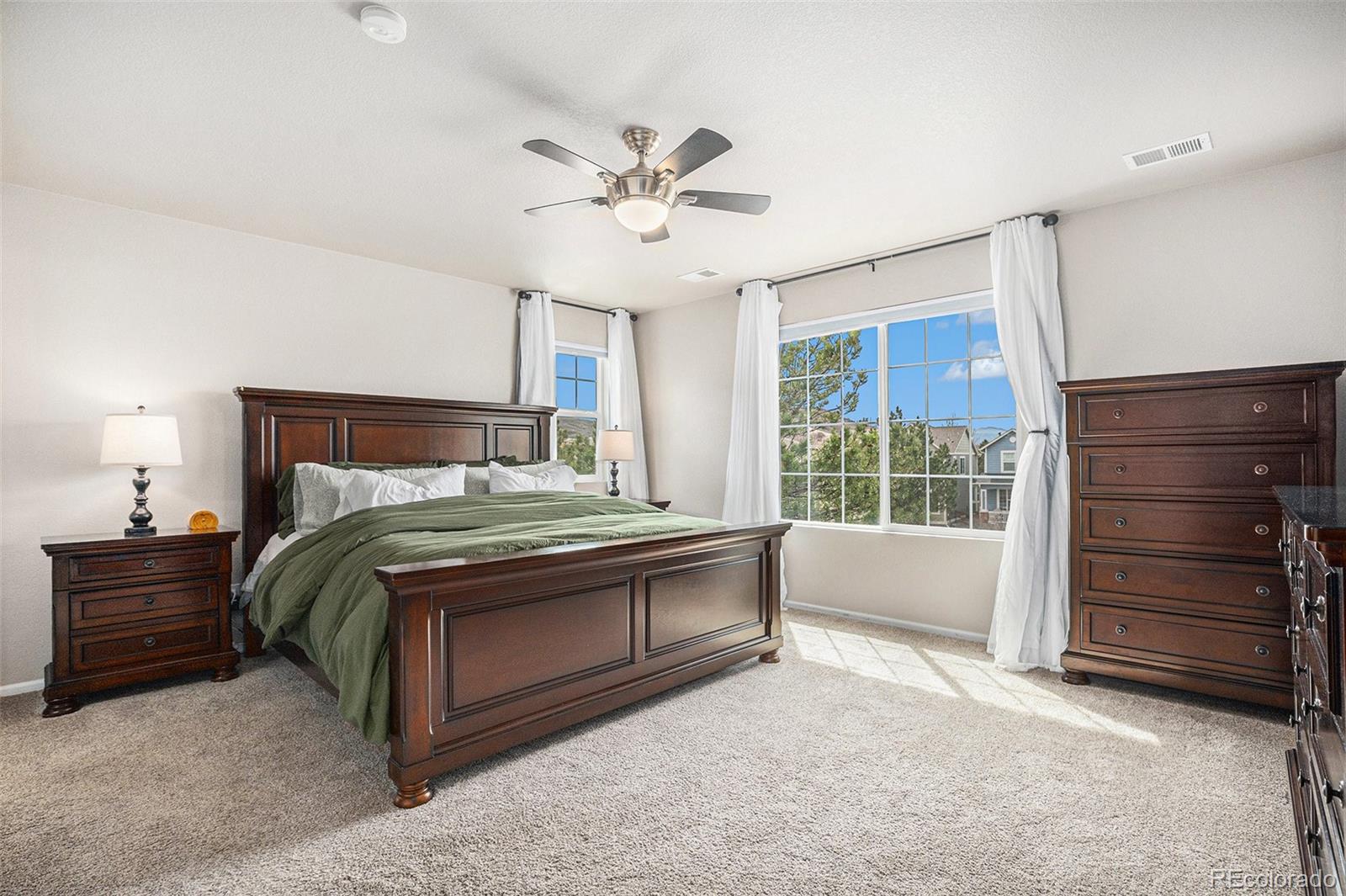 2470 Robindale Way Castle Rock, CO 80109 - Photo 21 of 42 a bedroom with a bed and a window