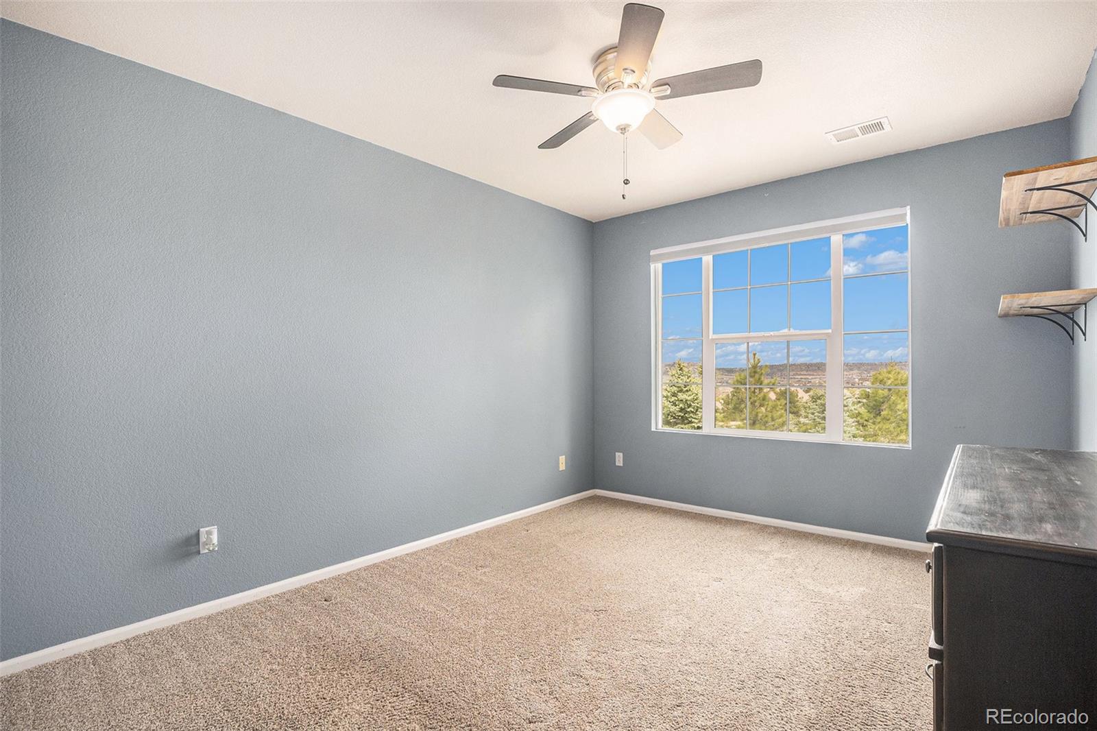 2470 Robindale Way Castle Rock, CO 80109 - Photo 25 of 42 an empty room with windows