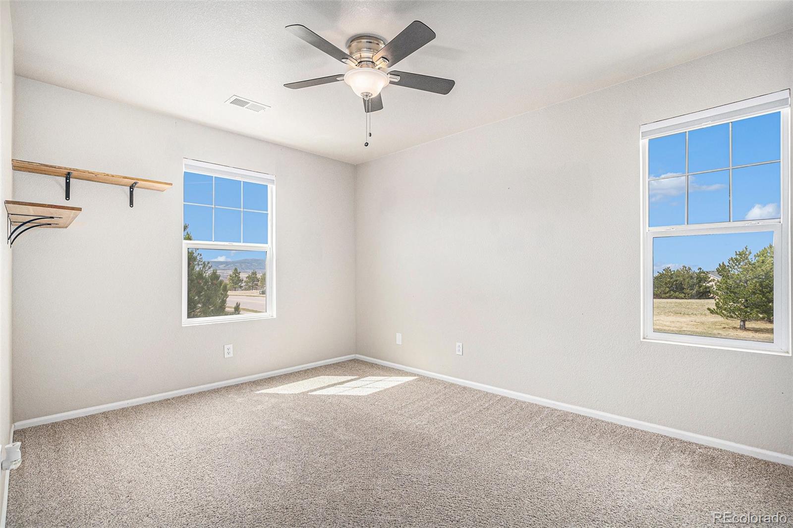 2470 Robindale Way Castle Rock, CO 80109 - Photo 26 of 42 an empty room with a window and a fan