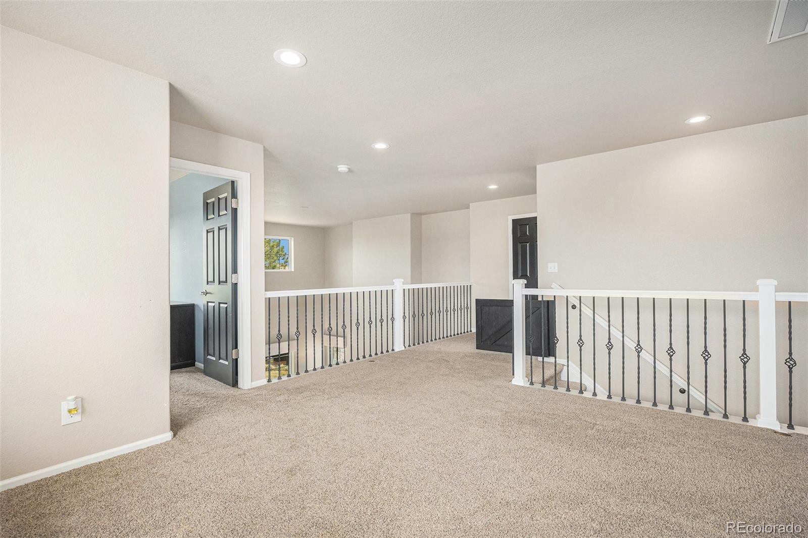 2470 Robindale Way Castle Rock, CO 80109 - Photo 28 of 42 a view of a hallway