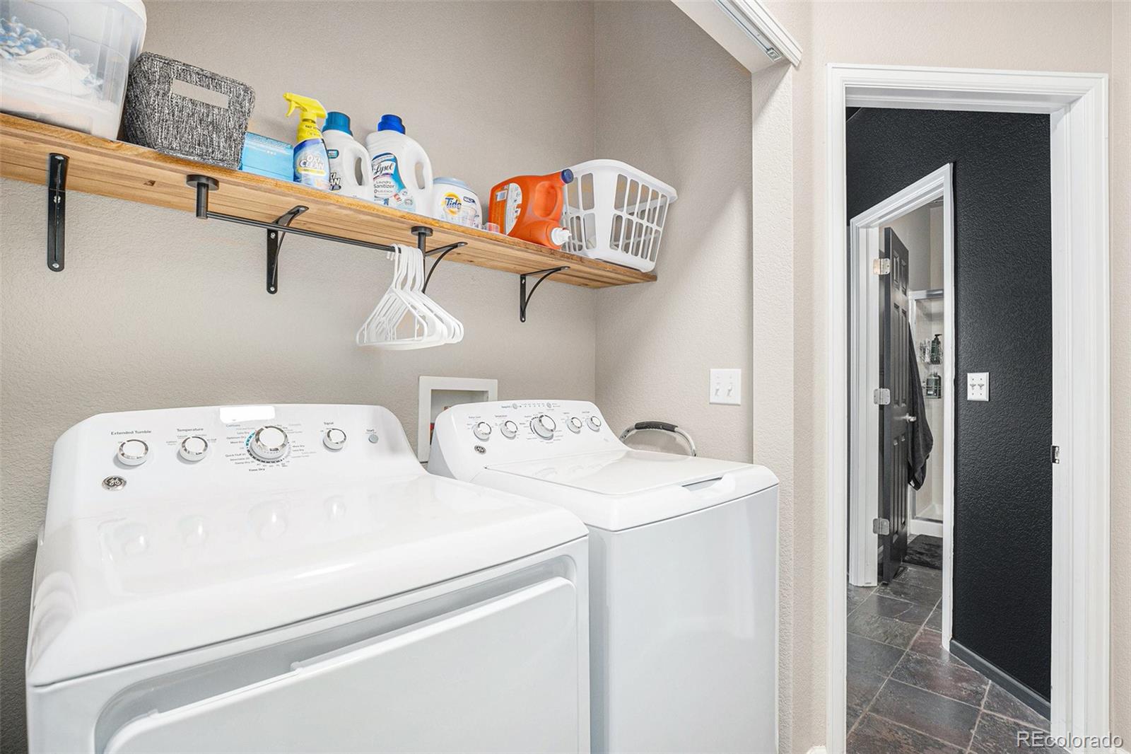 2470 Robindale Way Castle Rock, CO 80109 - Photo 33 of 42 a utility room with dryer and washer
