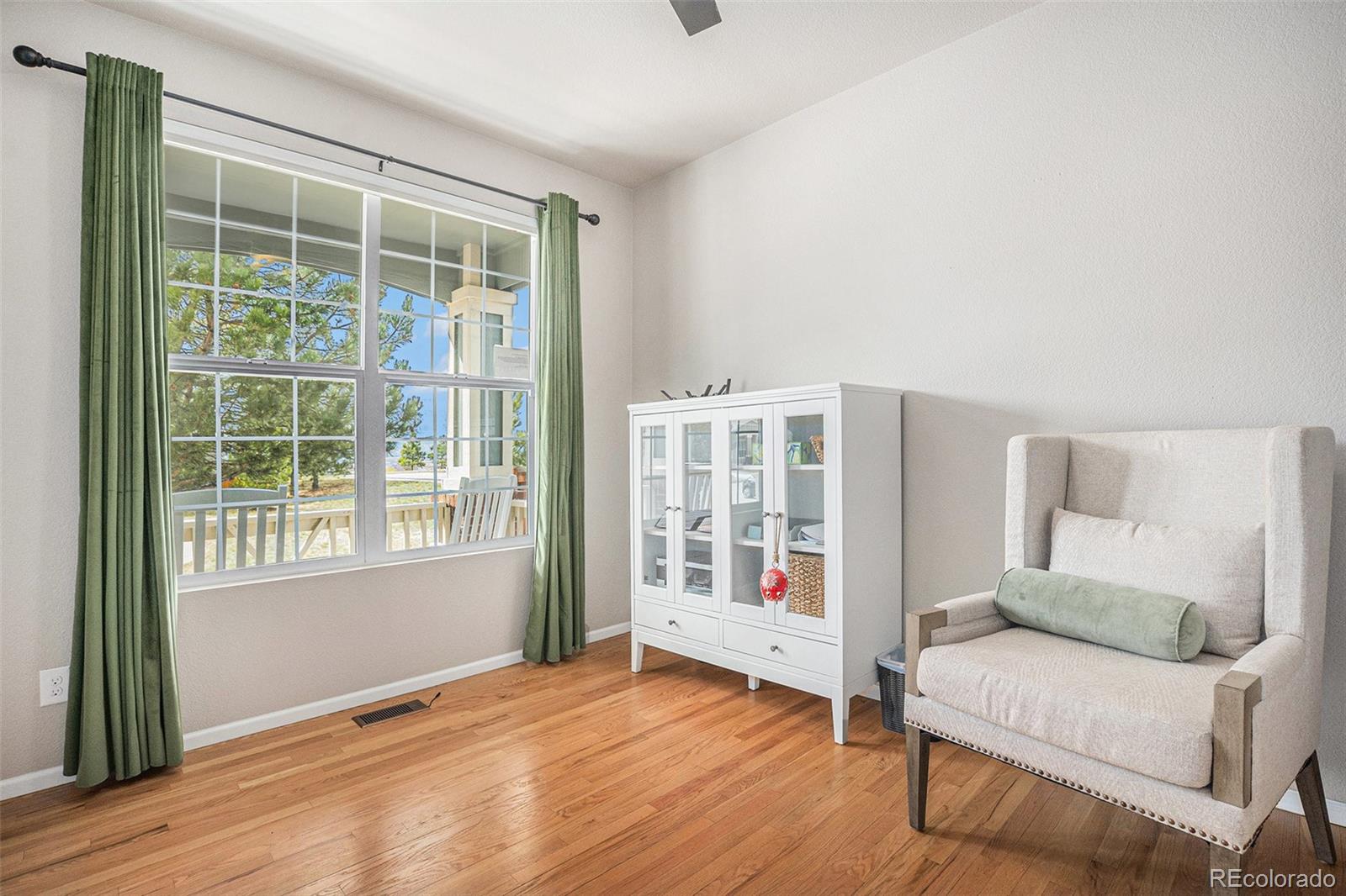 2470 Robindale Way Castle Rock, CO 80109 - Photo 6 of 42 a living room with furniture and a window
