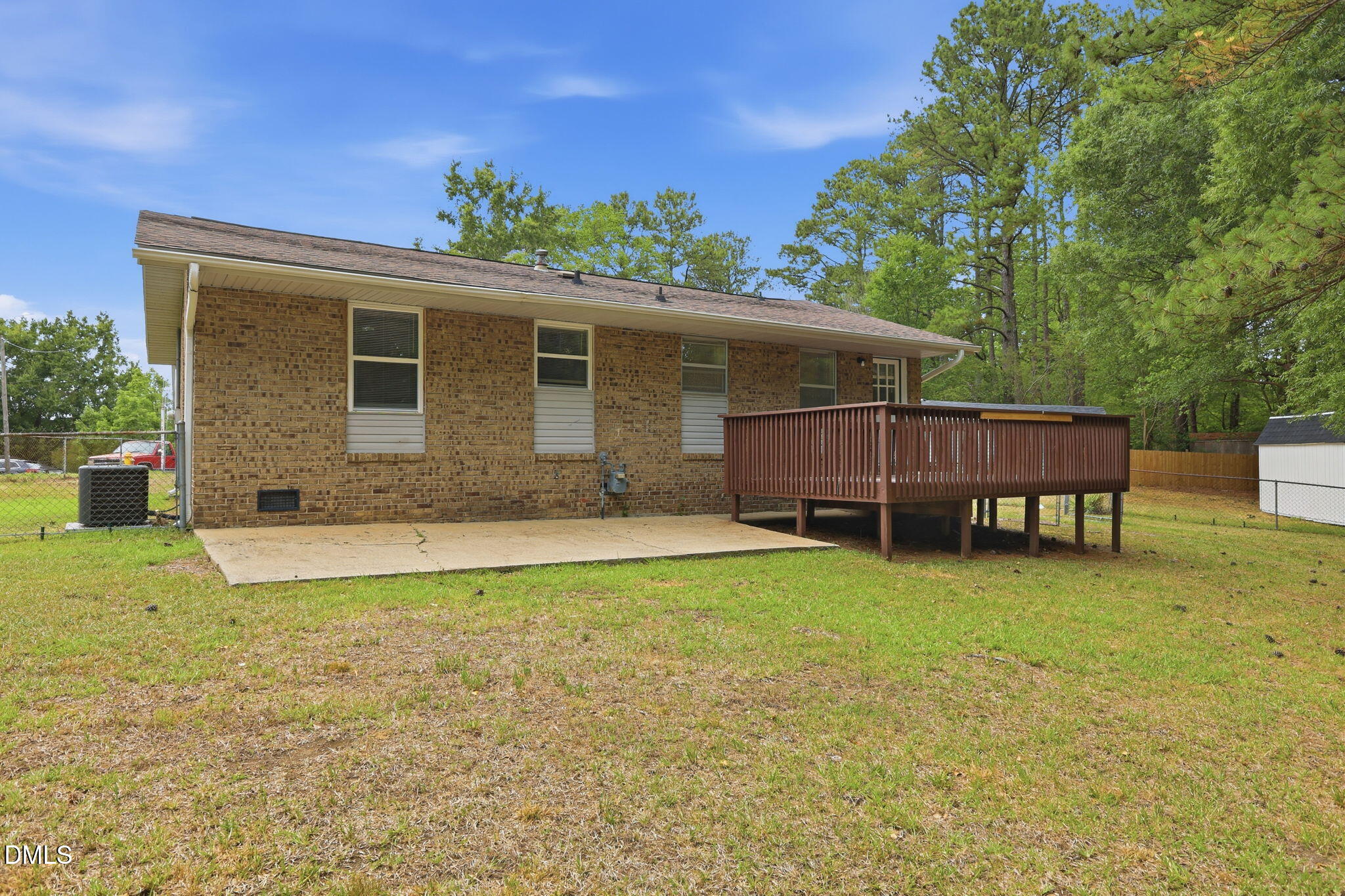 613 Juno Court Raleigh, NC 27610 - Photo 25 of 29 a view of a house with a yard and sitting area