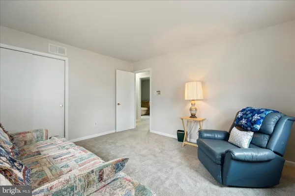a bedroom with a bed and couch