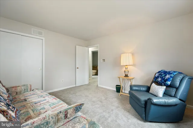 a bedroom with a bed and couch