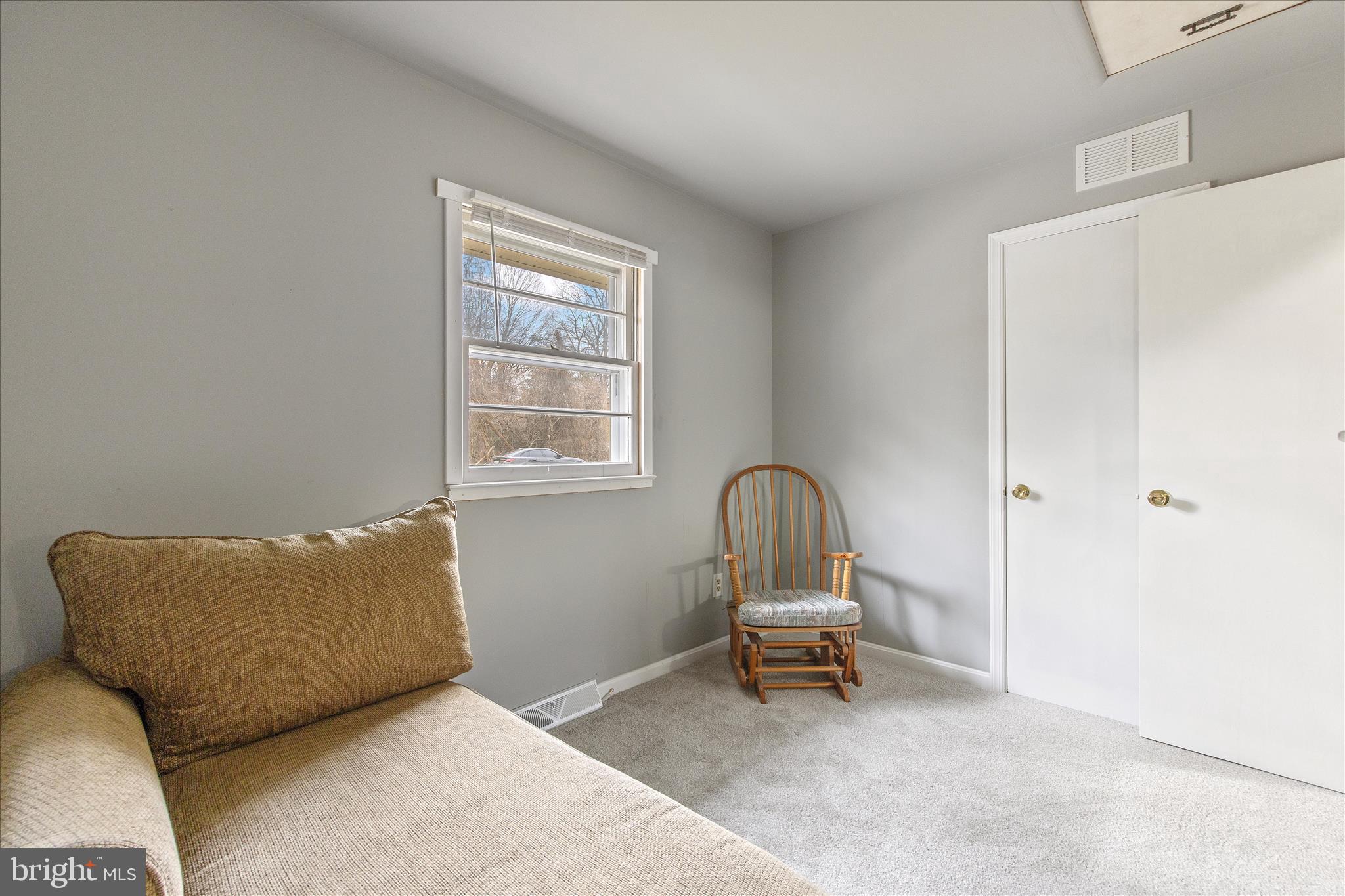 802 Lucky Road Severn, MD 21144 - Photo 23 of 32 a living room with furniture and a window