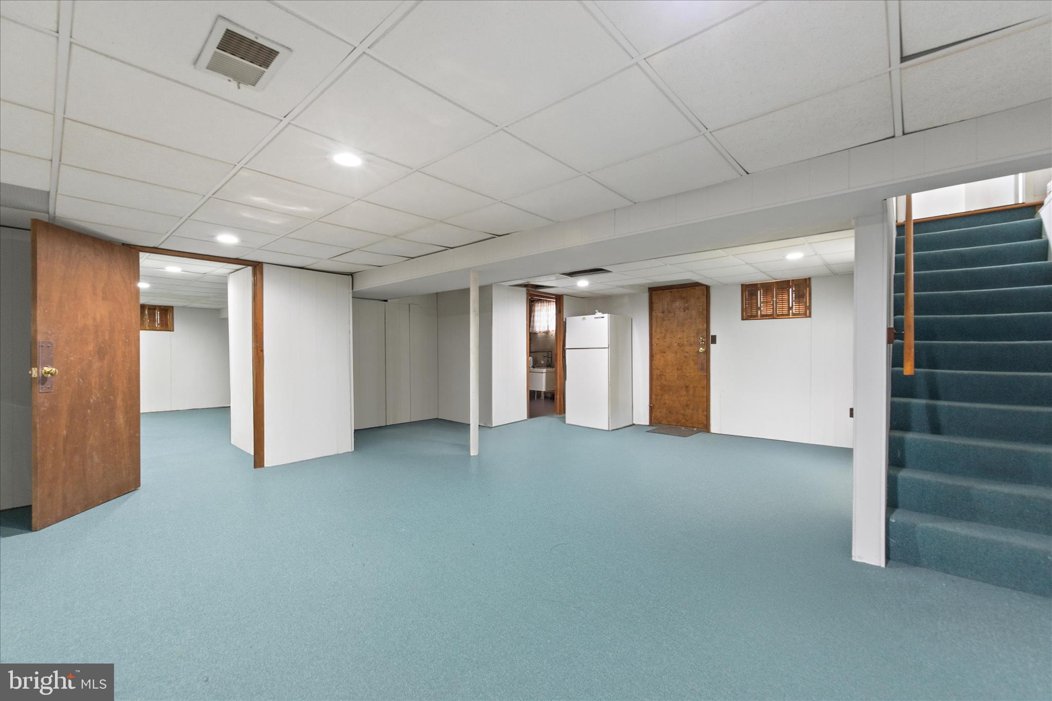 802 Lucky Road Severn, MD 21144 - Photo 25 of 32 a view of empty room with stairs and a window
