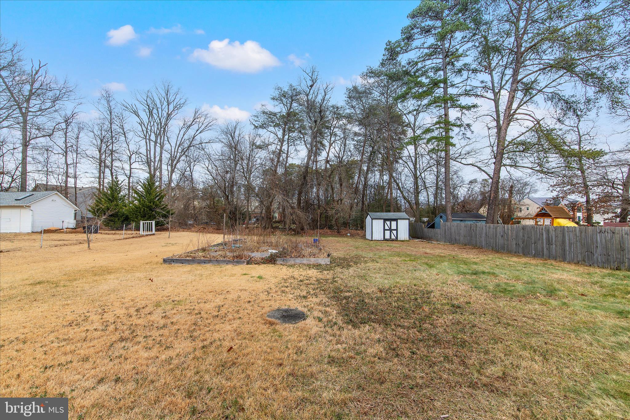 802 Lucky Road Severn, MD 21144 - Photo 30 of 32 a house with trees in front of it