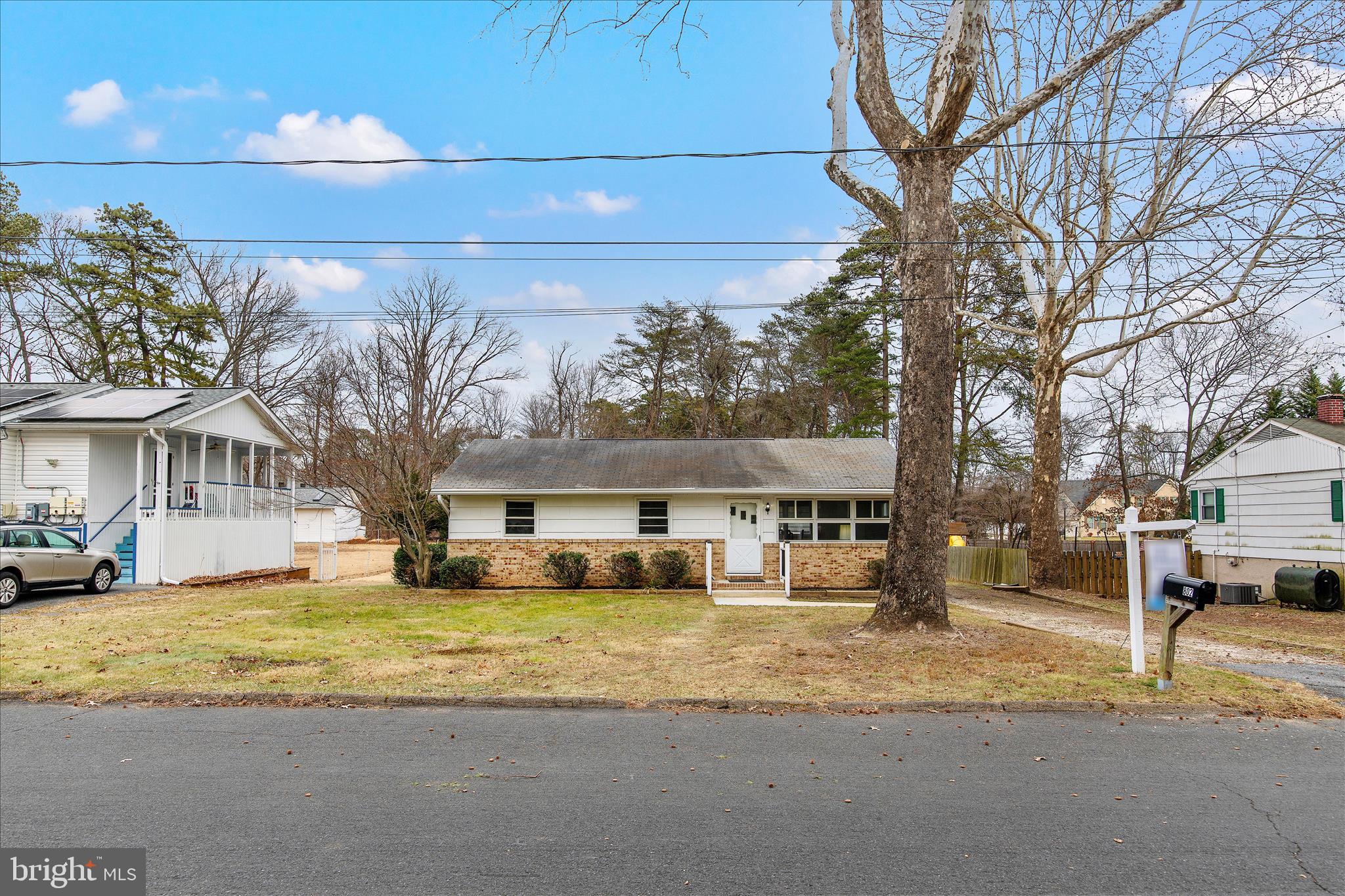 802 Lucky Road Severn, MD 21144 - Photo 4 of 32 a view of a house with a yard covered in snow