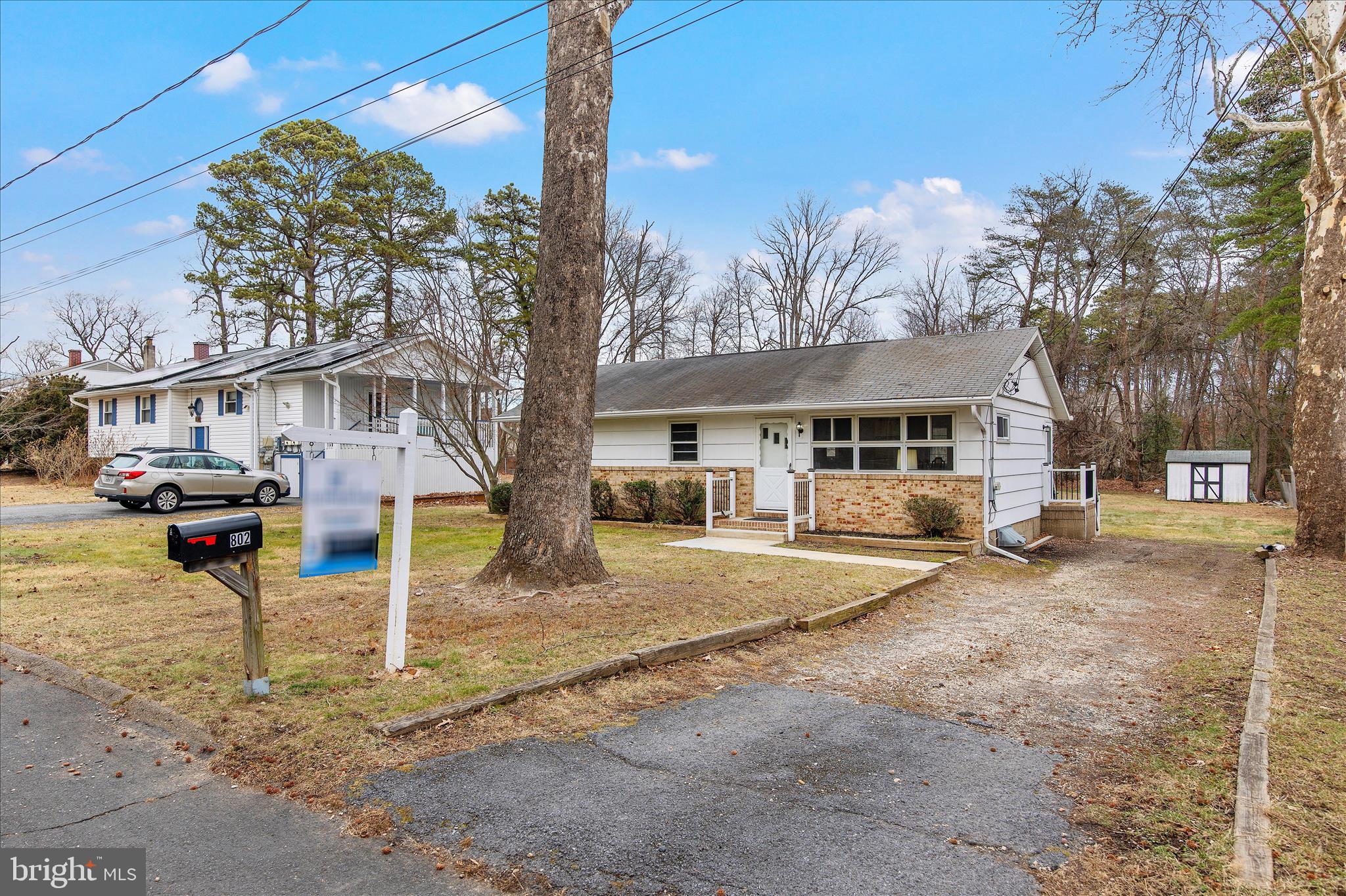 802 Lucky Road Severn, MD 21144 - Photo 5 of 32 a front view of a house with a yard