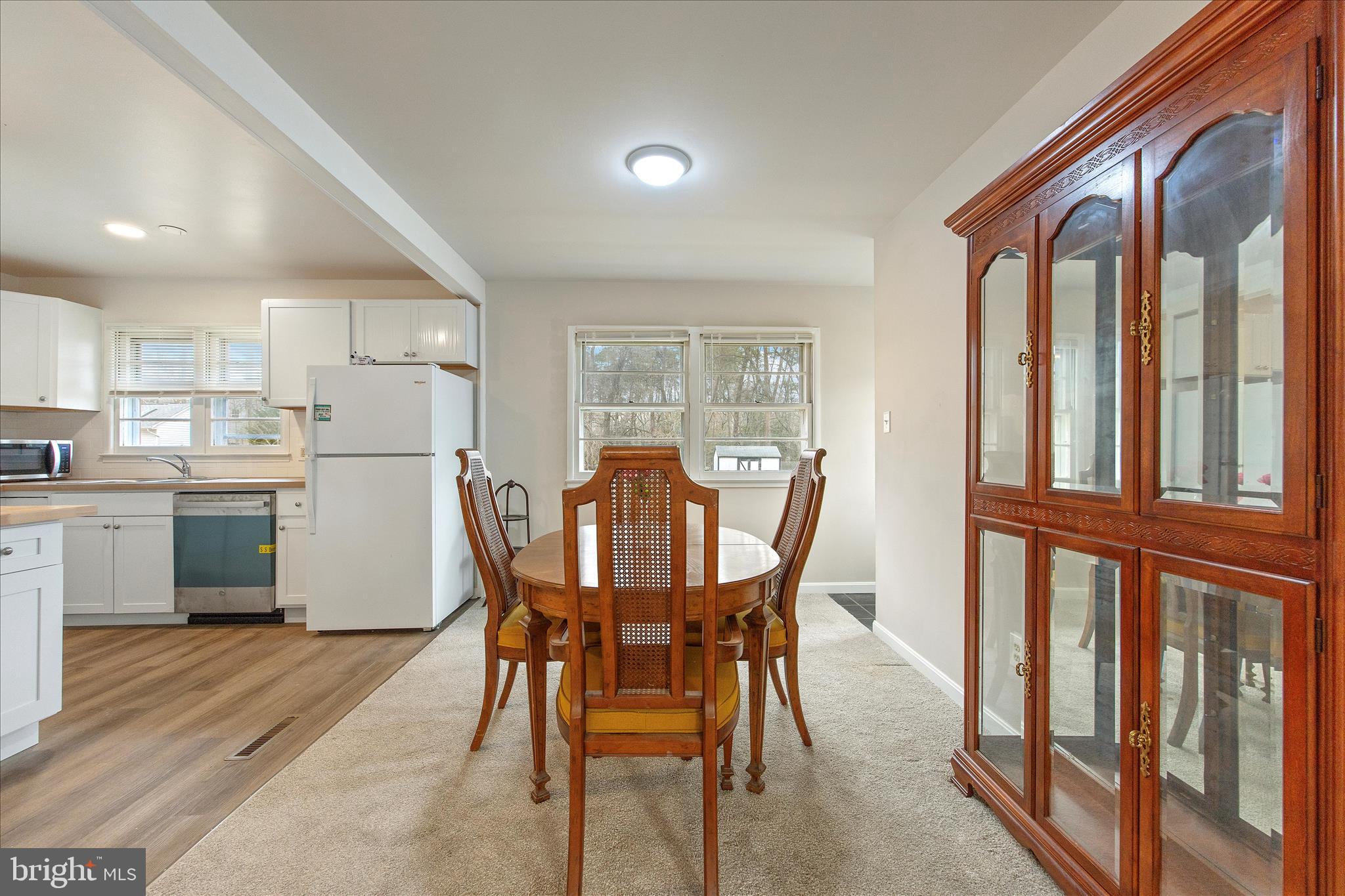 802 Lucky Road Severn, MD 21144 - Photo 10 of 32 a view of a dining room with furniture and wooden floor