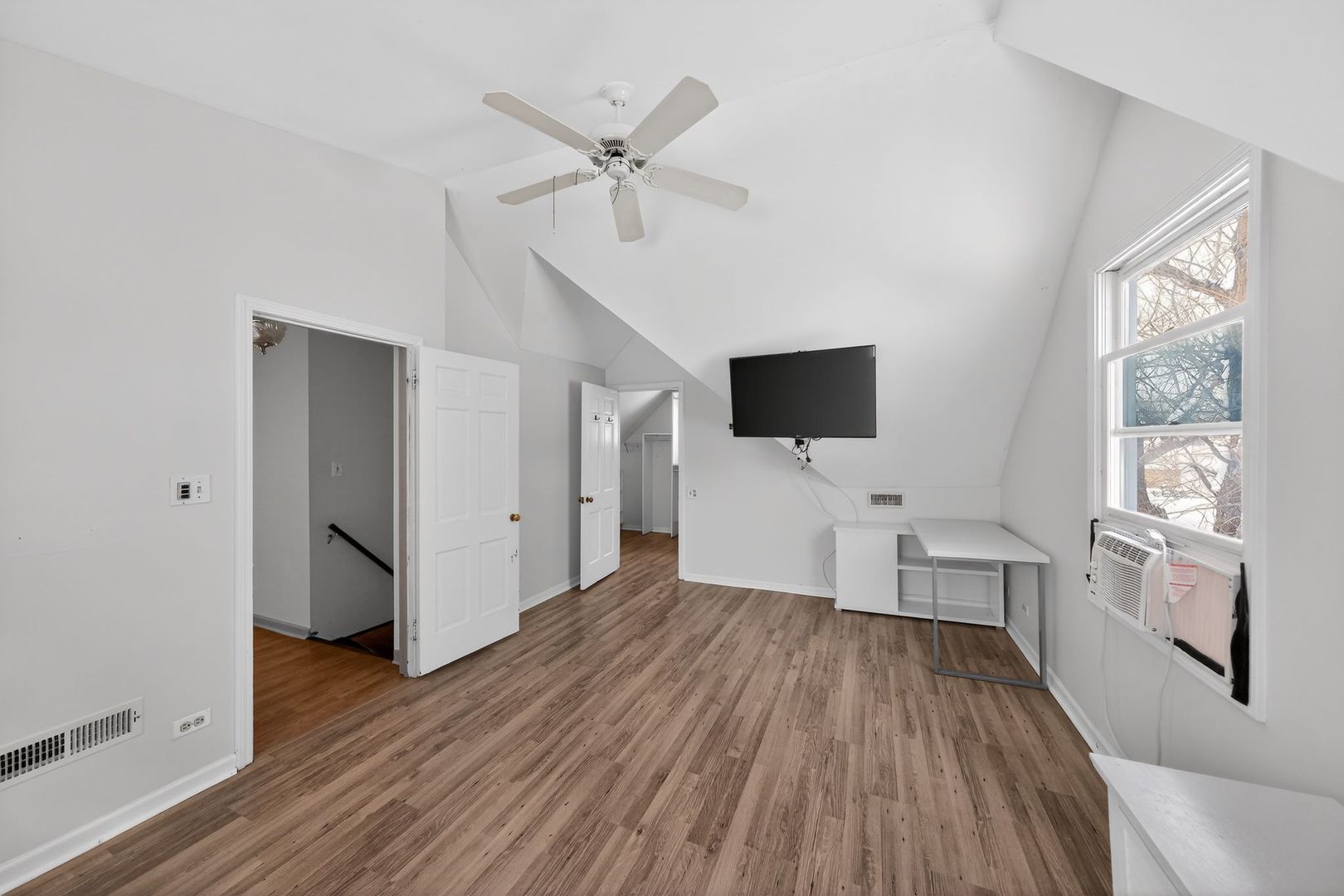 521 Deerfield Road Deerfield, IL 60015 - Photo 30 of 30 a view of a livingroom with wooden floor and a flat screen tv