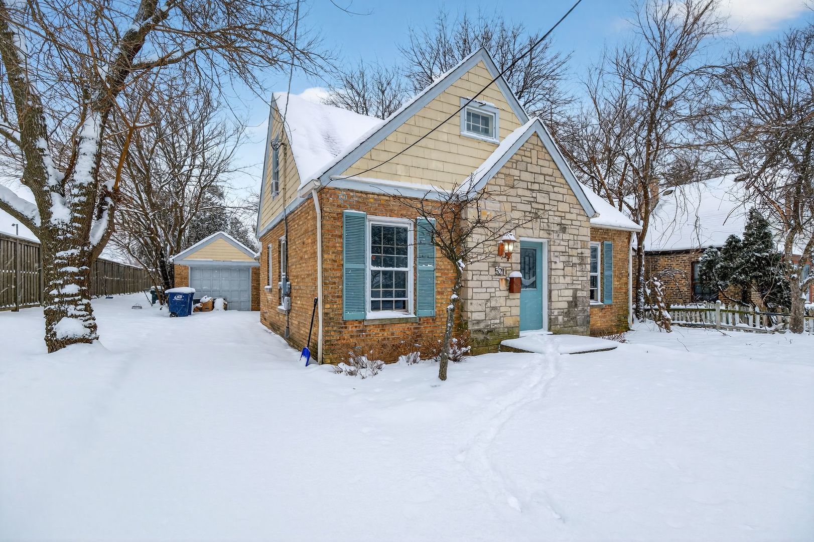 521 Deerfield Road Deerfield, IL 60015 - Photo 4 of 30 a view of house with a yard covered in snow