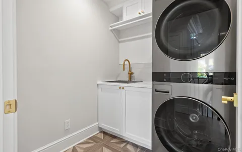 a bathroom with a sink and a washer