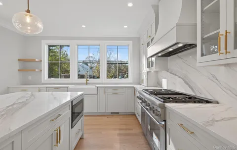 a kitchen with a sink stove and window