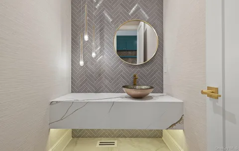 a bathroom with a sink and mirror