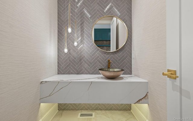 a bathroom with a sink and mirror