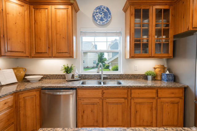896 Cres Drive South Mapleton, UT 84664 - Photo 9 of 32 Kitchen featuring wood cabinetry, a stainless steel double basin sink, and granite countertops