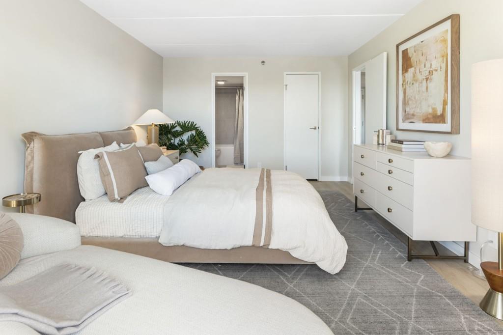 2460 Peachtree Road Northeast, Unit 1105 Atlanta, GA 30305 - Photo 25 of 51 a large white bed in a white room