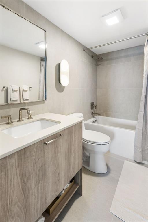 2460 Peachtree Road Northeast, Unit 1105 Atlanta, GA 30305 - Photo 31 of 51 a bathroom with a sink a toilet and a mirror