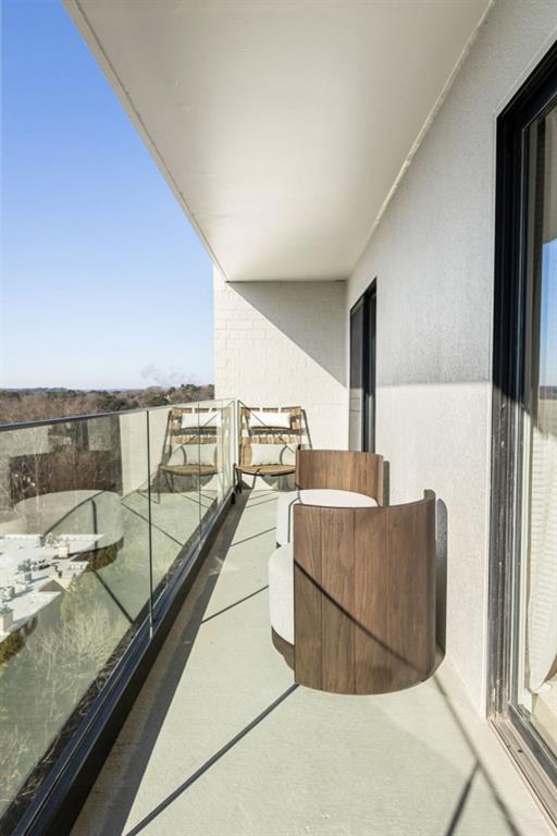2460 Peachtree Road Northeast, Unit 1105 Atlanta, GA 30305 - Photo 39 of 51 a living room with furniture and a flat screen tv