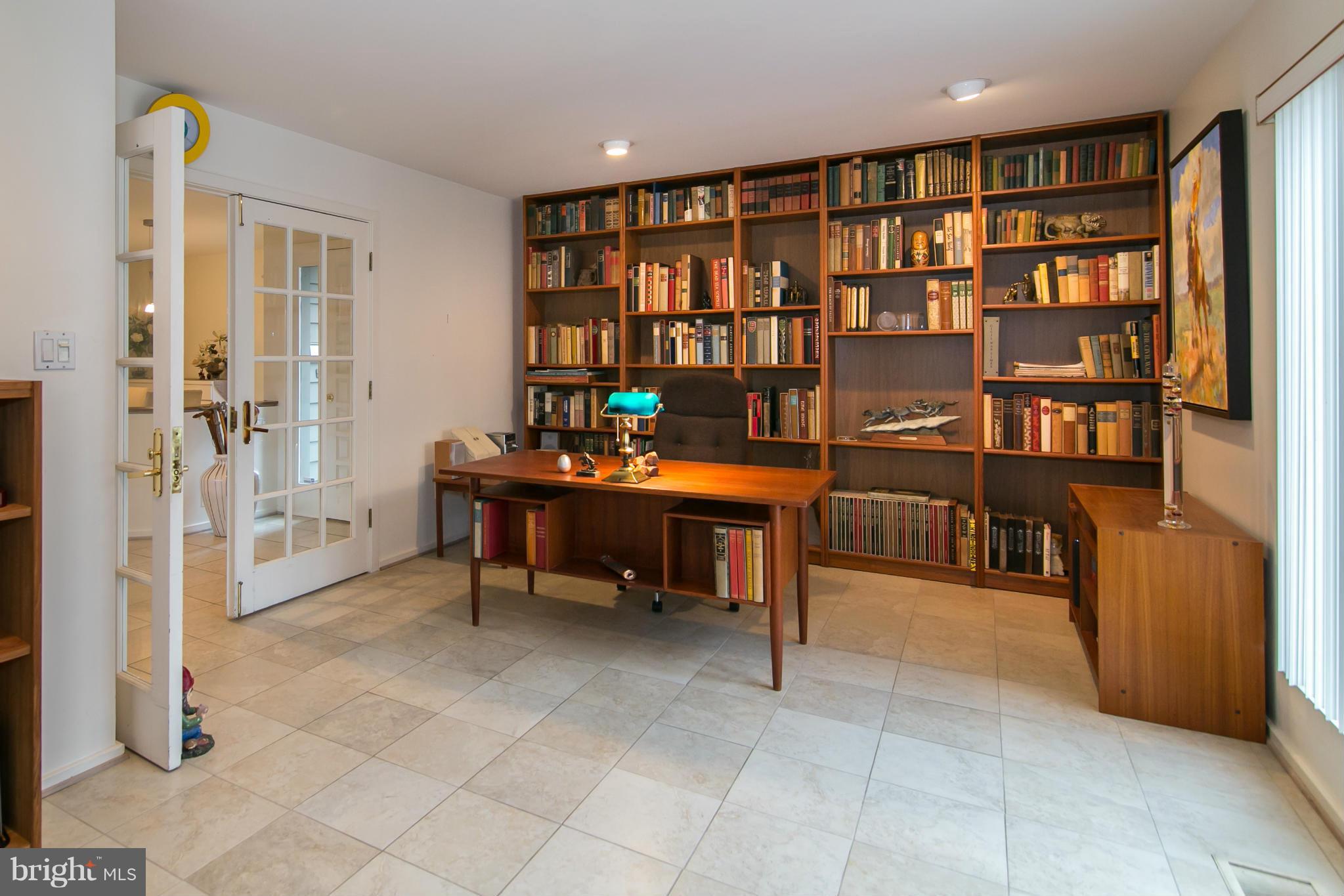 11915 State Rte 4707 Reston, VA 20191 - Photo 8 of 30 a work room with furniture and a book shelf