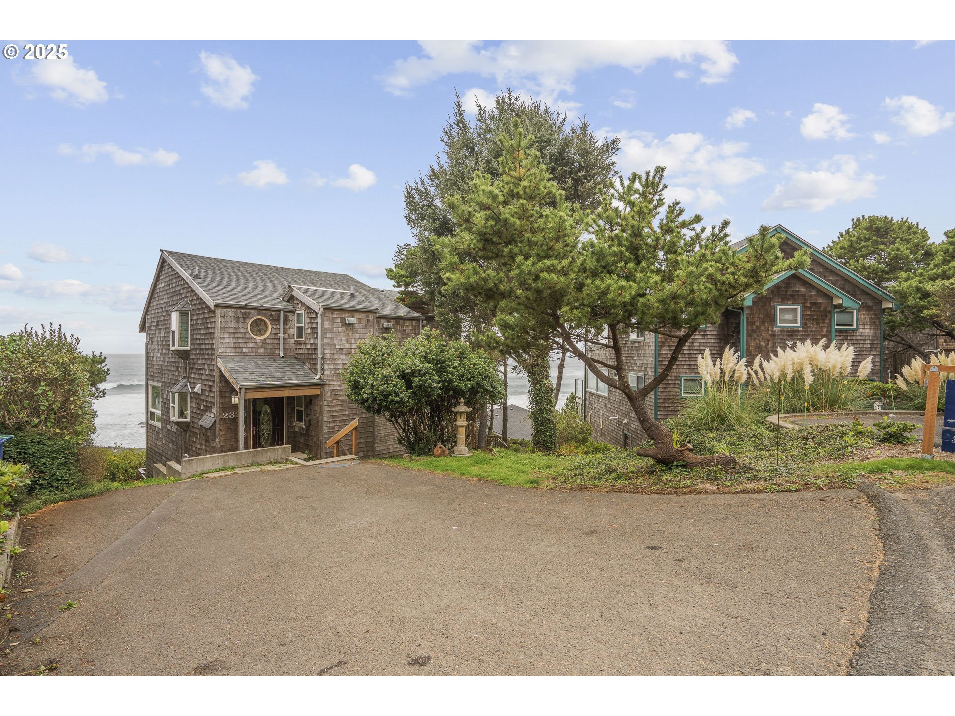 2325 Southwest Bard Loop Lincoln City, OR 97367 - Photo 15 of 28 a view of a street with a building in the background