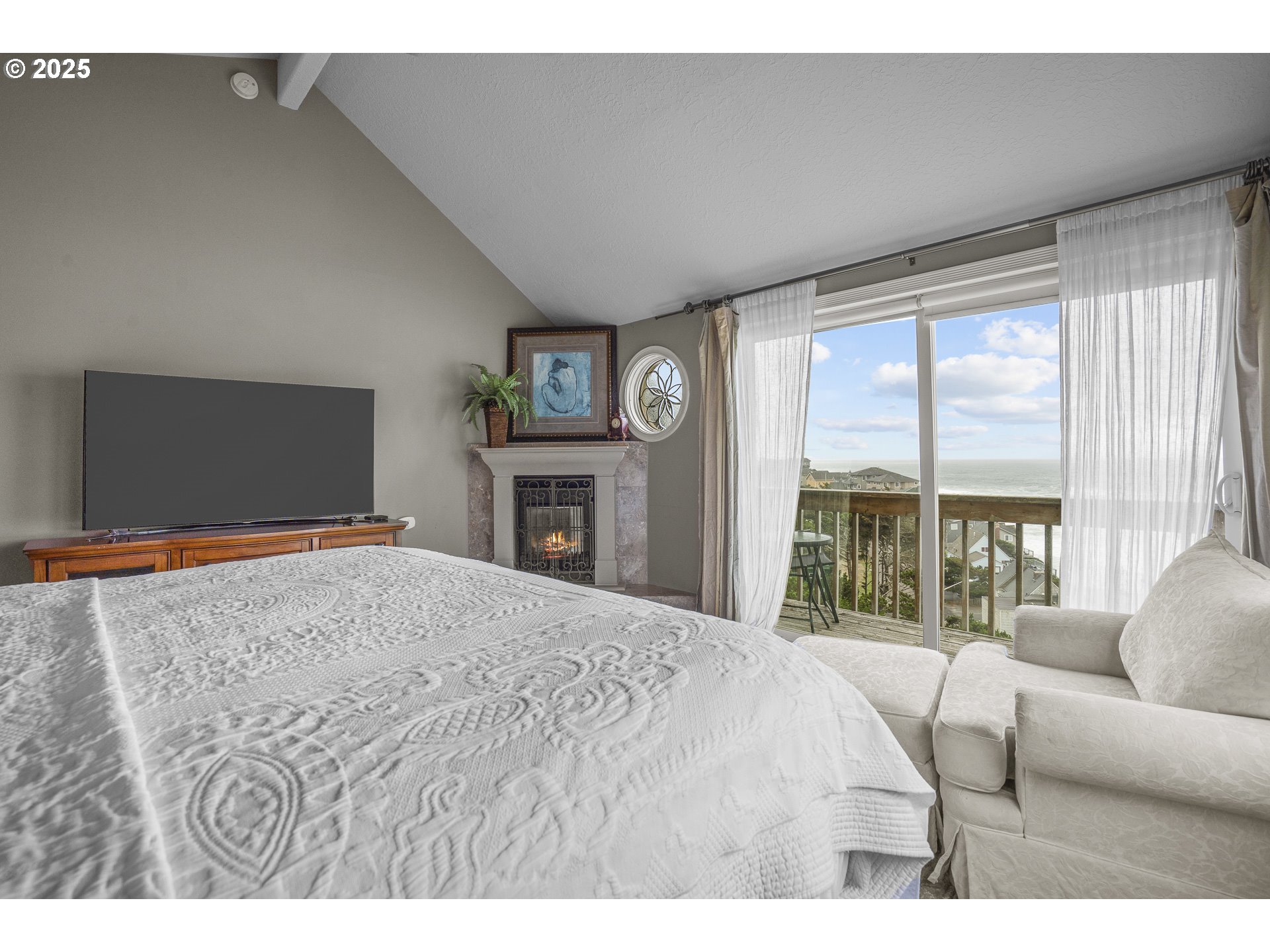 2325 Southwest Bard Loop Lincoln City, OR 97367 - Photo 20 of 28 a bedroom with a bed and a large window