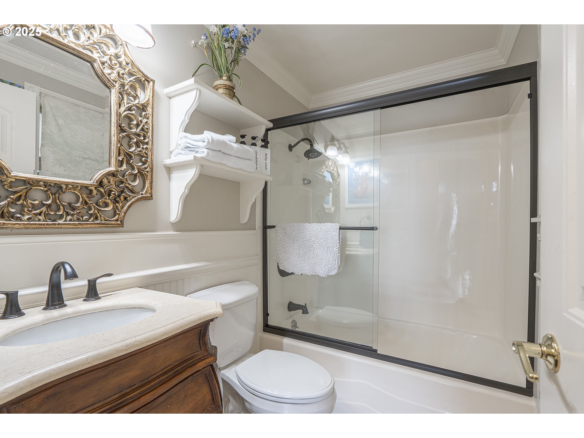 2325 Southwest Bard Loop Lincoln City, OR 97367 - Photo 22 of 28 a bathroom with a sink toilet a mirror and shower