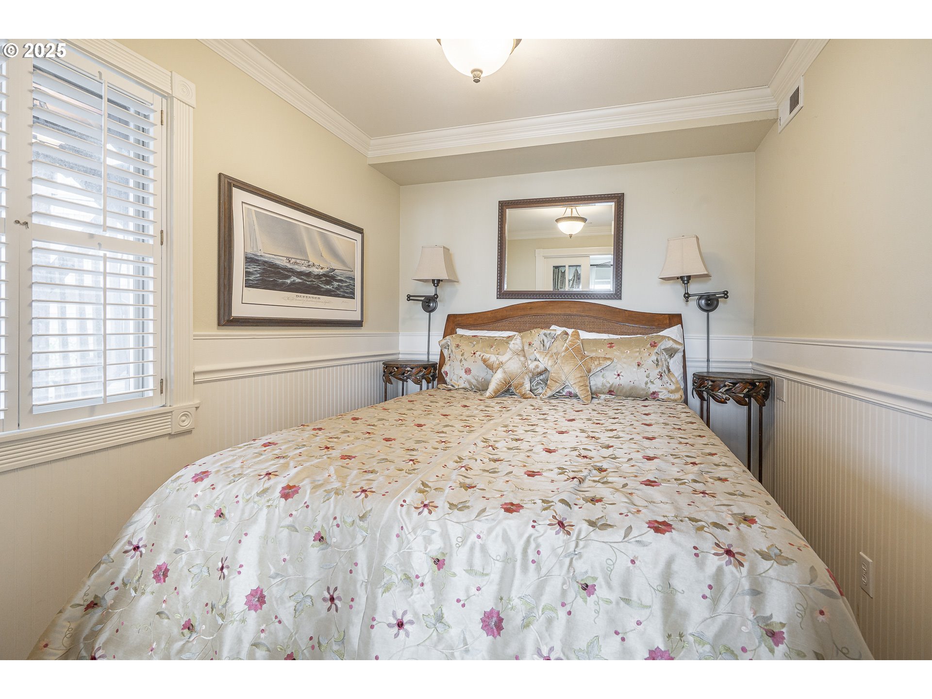 2325 Southwest Bard Loop Lincoln City, OR 97367 - Photo 4 of 28 a bedroom with a large bed and a window