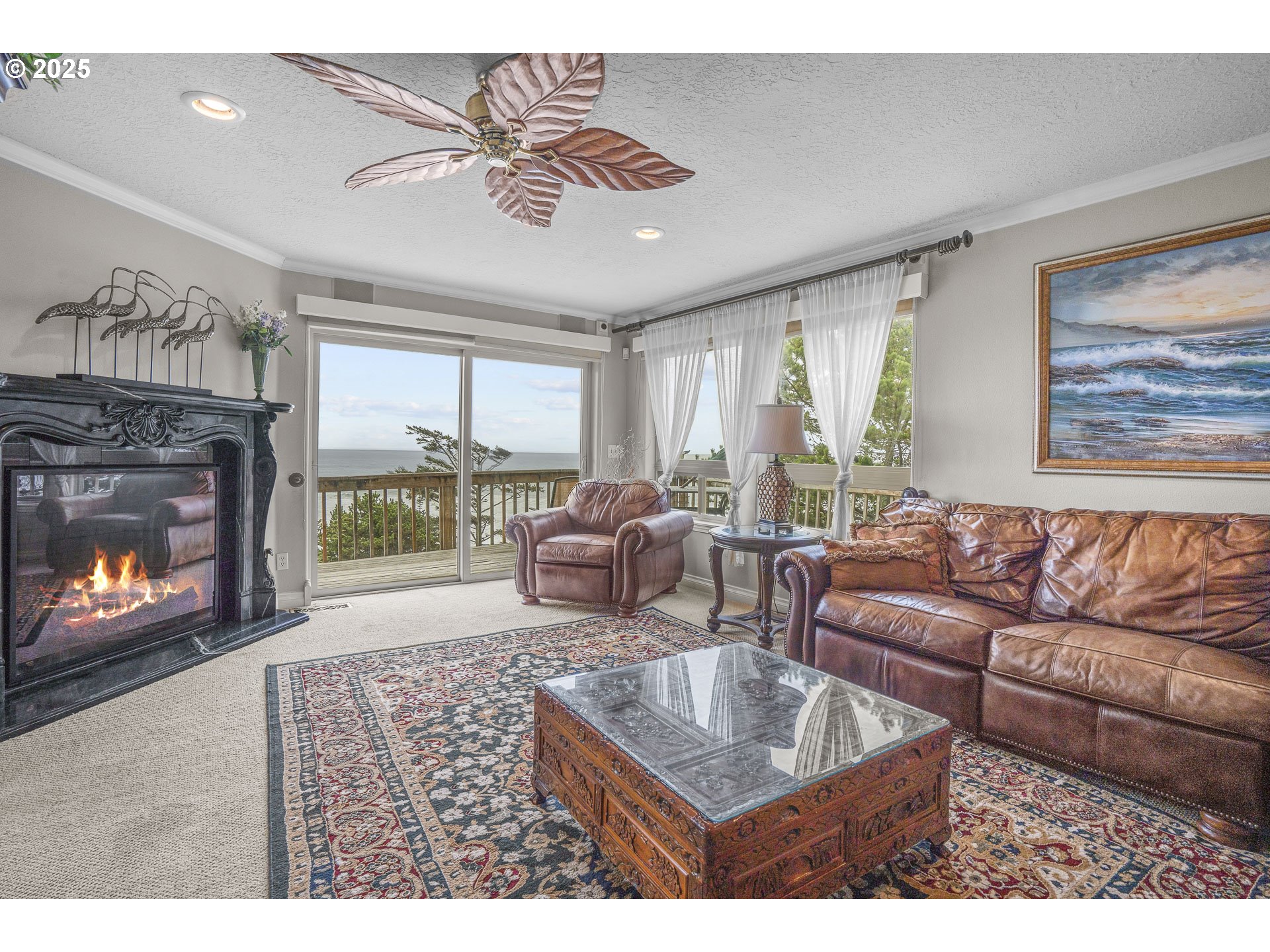 2325 Southwest Bard Loop Lincoln City, OR 97367 - Photo 5 of 28 a living room with furniture and a fireplace