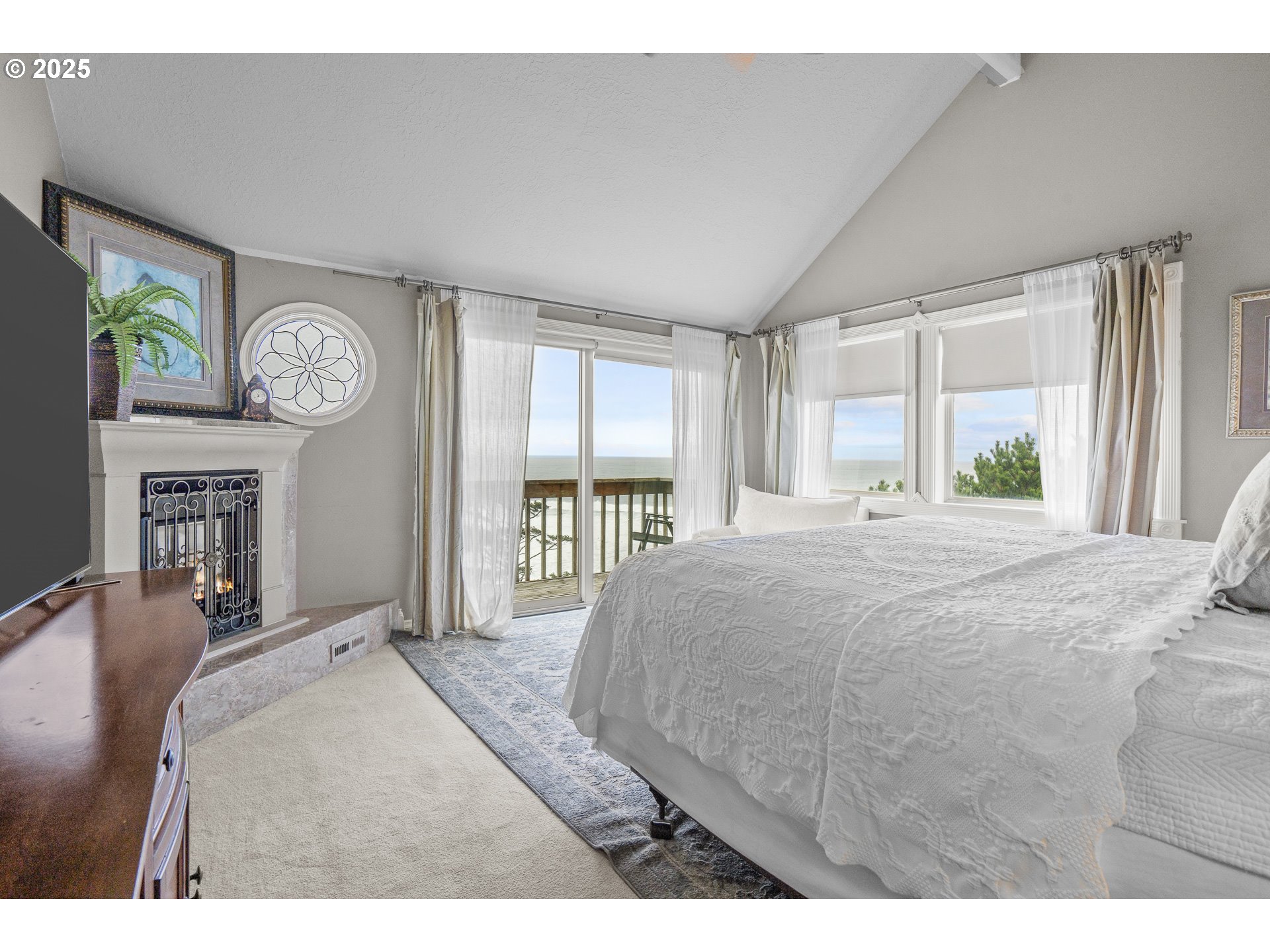 2325 Southwest Bard Loop Lincoln City, OR 97367 - Photo 6 of 28 a bedroom with a bed and a large window