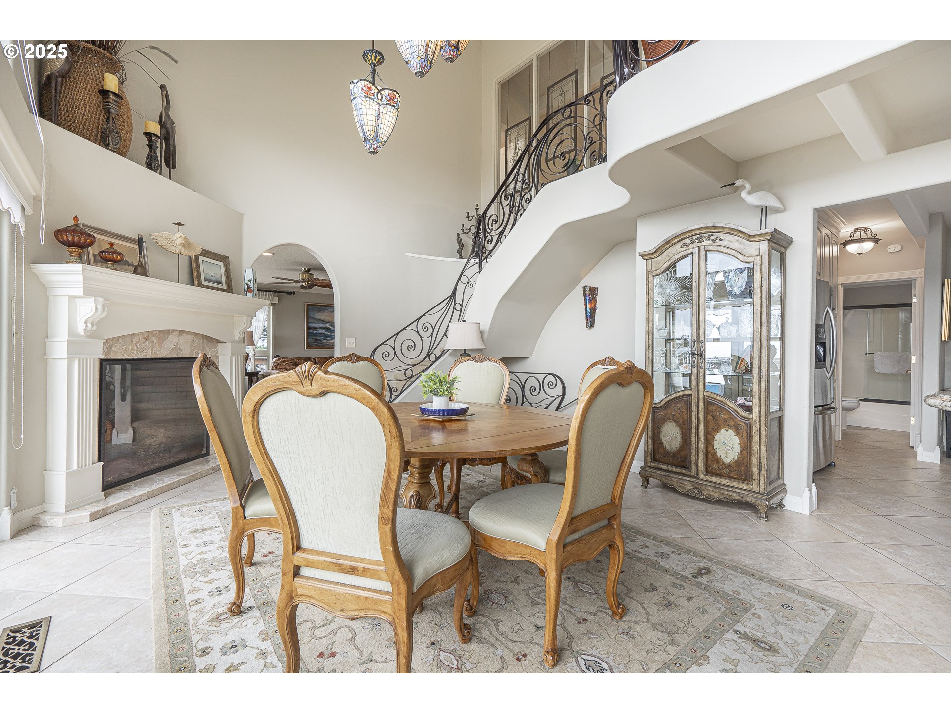 2325 Southwest Bard Loop Lincoln City, OR 97367 - Photo 8 of 28 a dining room with furniture and a fireplace