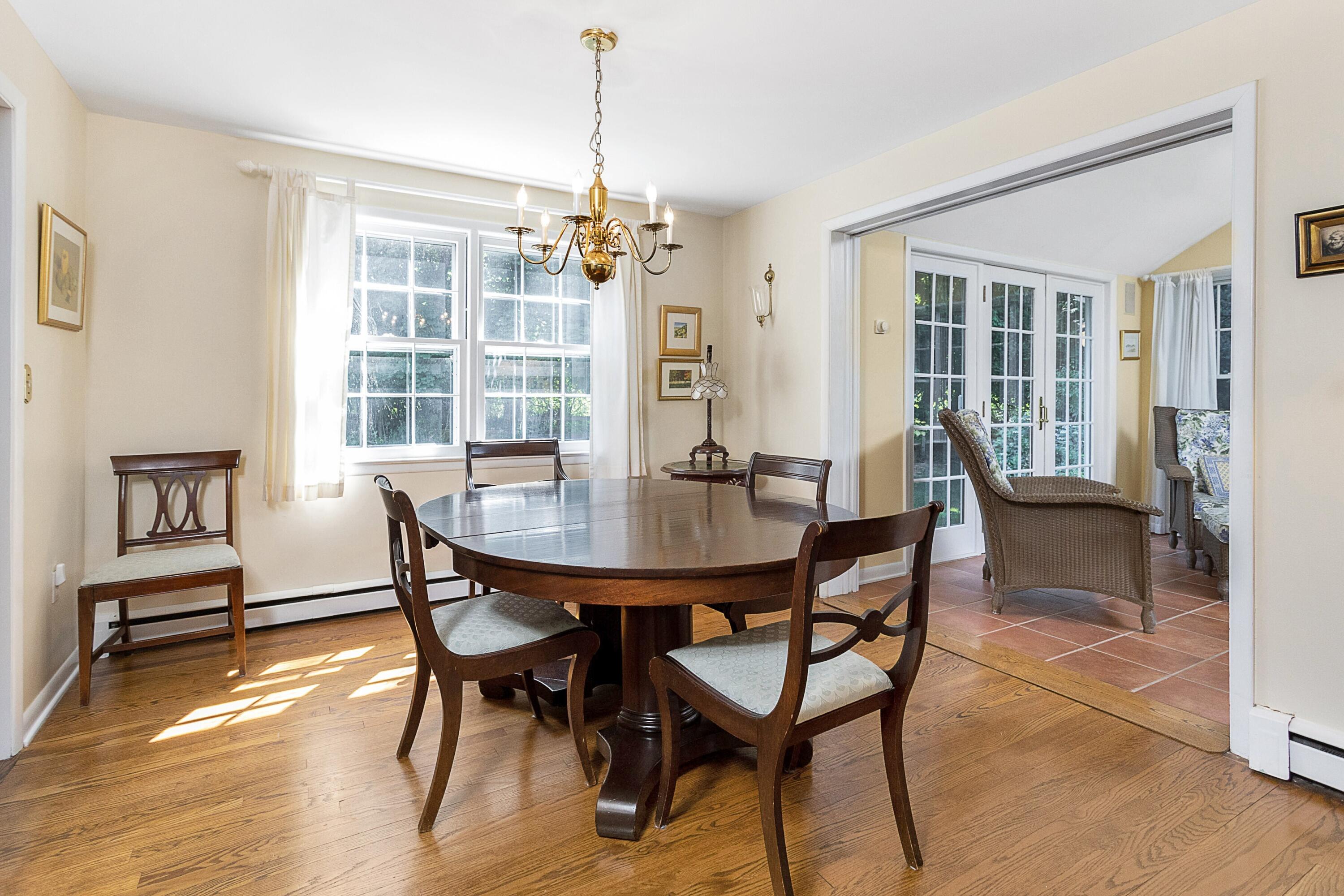 10 Wilson Ridge Road East Darien, CT 06820 - Photo 13 of 25 a view of a dining room with furniture window and wooden floor