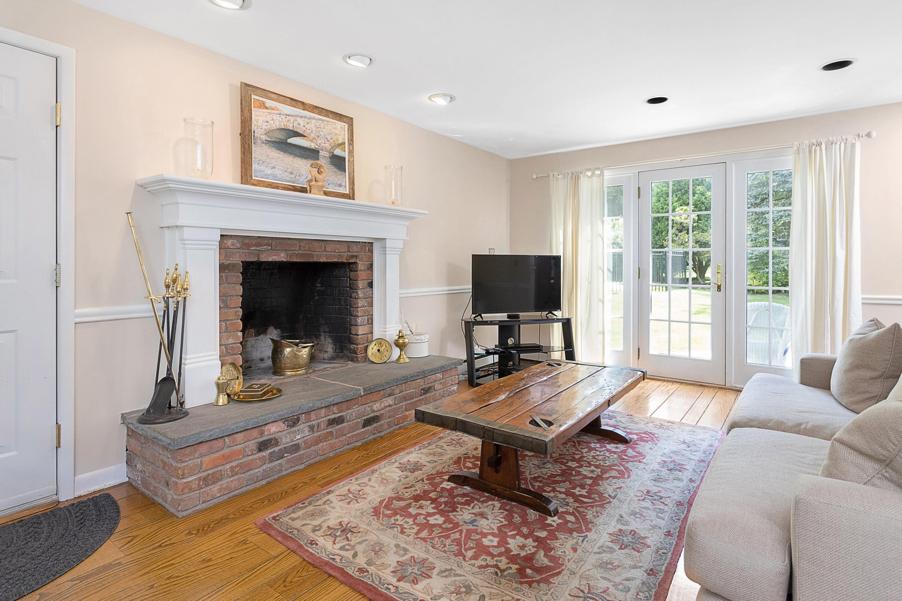 10 Wilson Ridge Road East Darien, CT 06820 - Photo 14 of 25 a living room with furniture and a fireplace