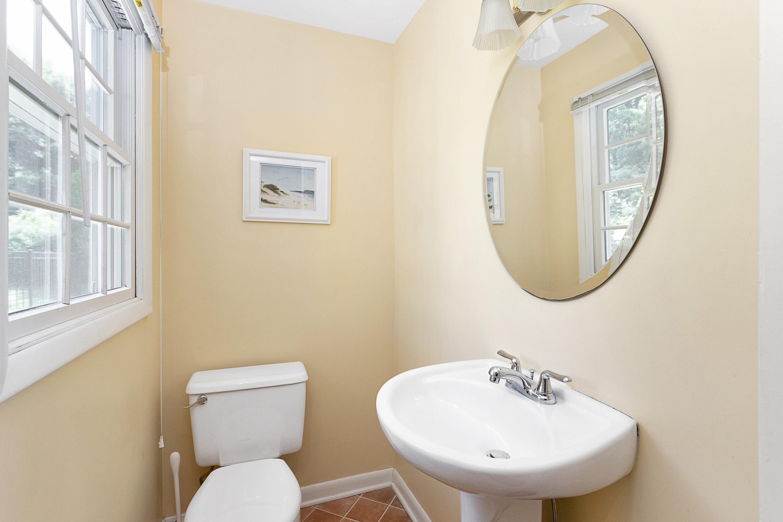 10 Wilson Ridge Road East Darien, CT 06820 - Photo 16 of 25 a bathroom with a toilet a sink and a mirror