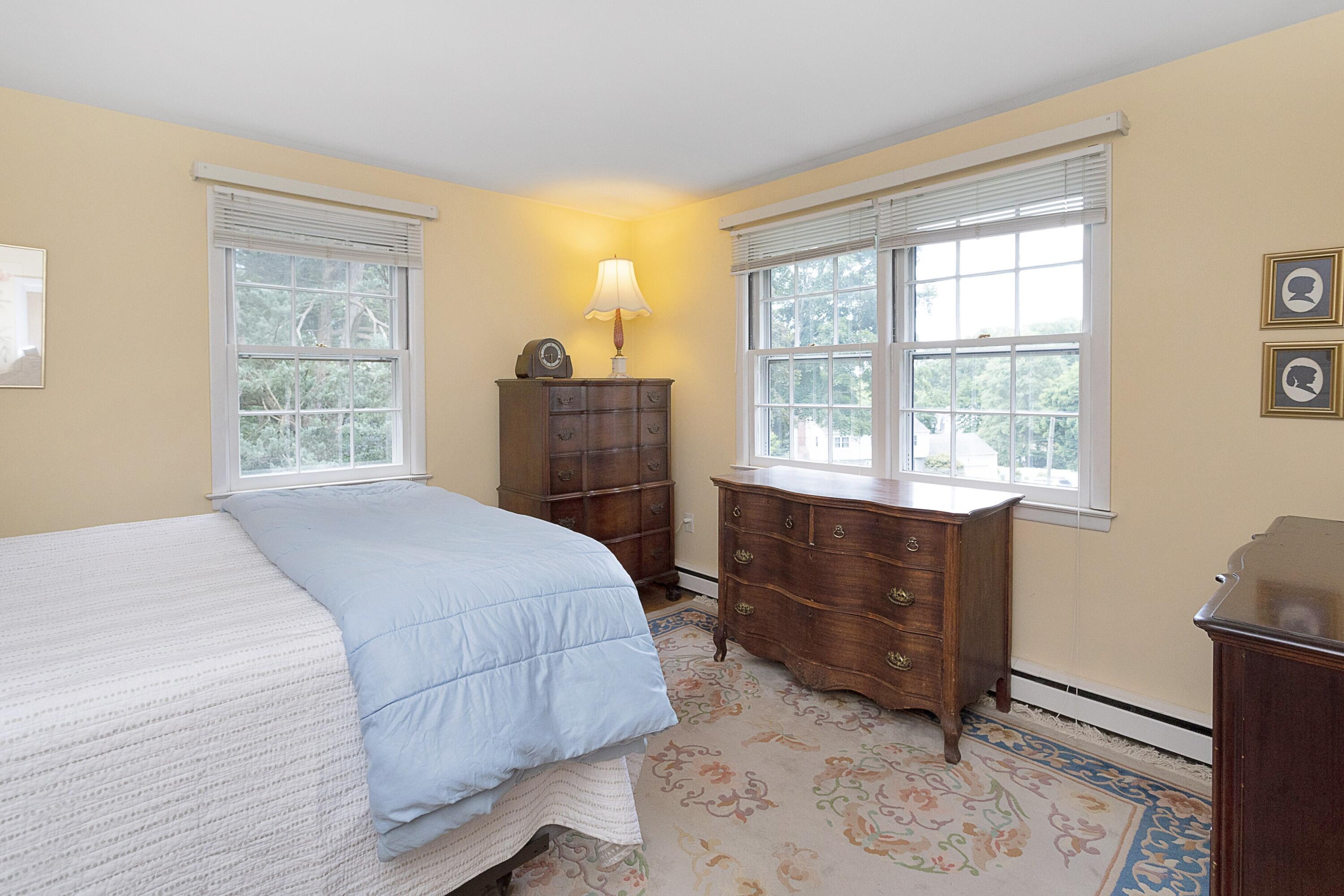 10 Wilson Ridge Road East Darien, CT 06820 - Photo 19 of 25 a bedroom with a bed and window