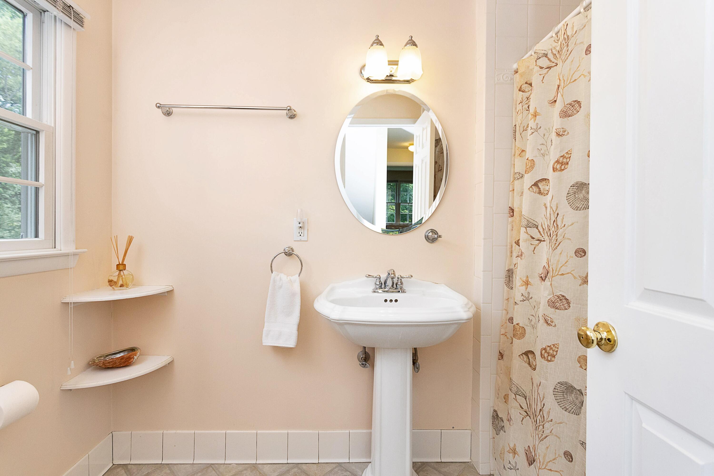 10 Wilson Ridge Road East Darien, CT 06820 - Photo 20 of 25 a bathroom with a sink mirror and toilet