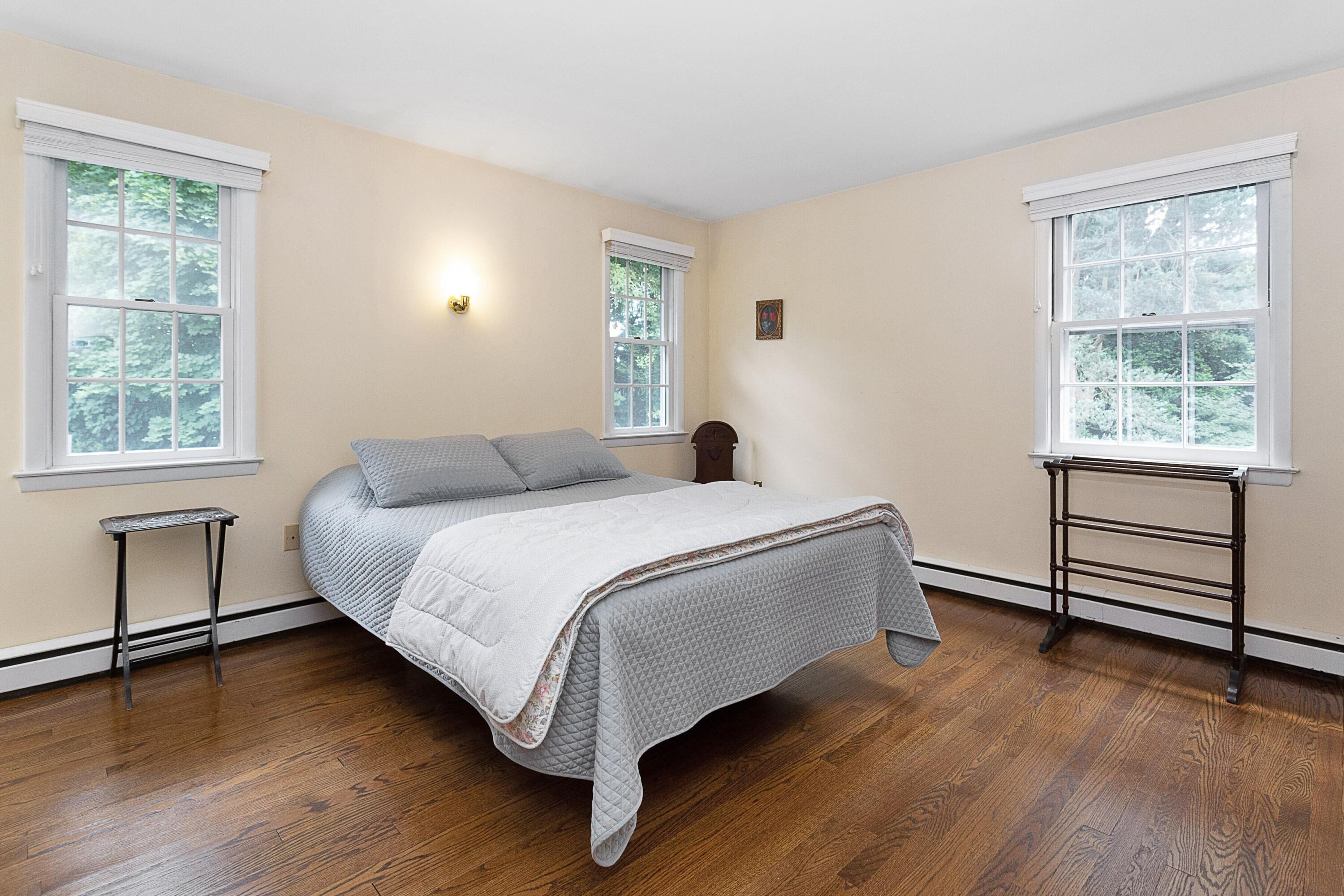 10 Wilson Ridge Road East Darien, CT 06820 - Photo 21 of 25 a bedroom with a bed and a window