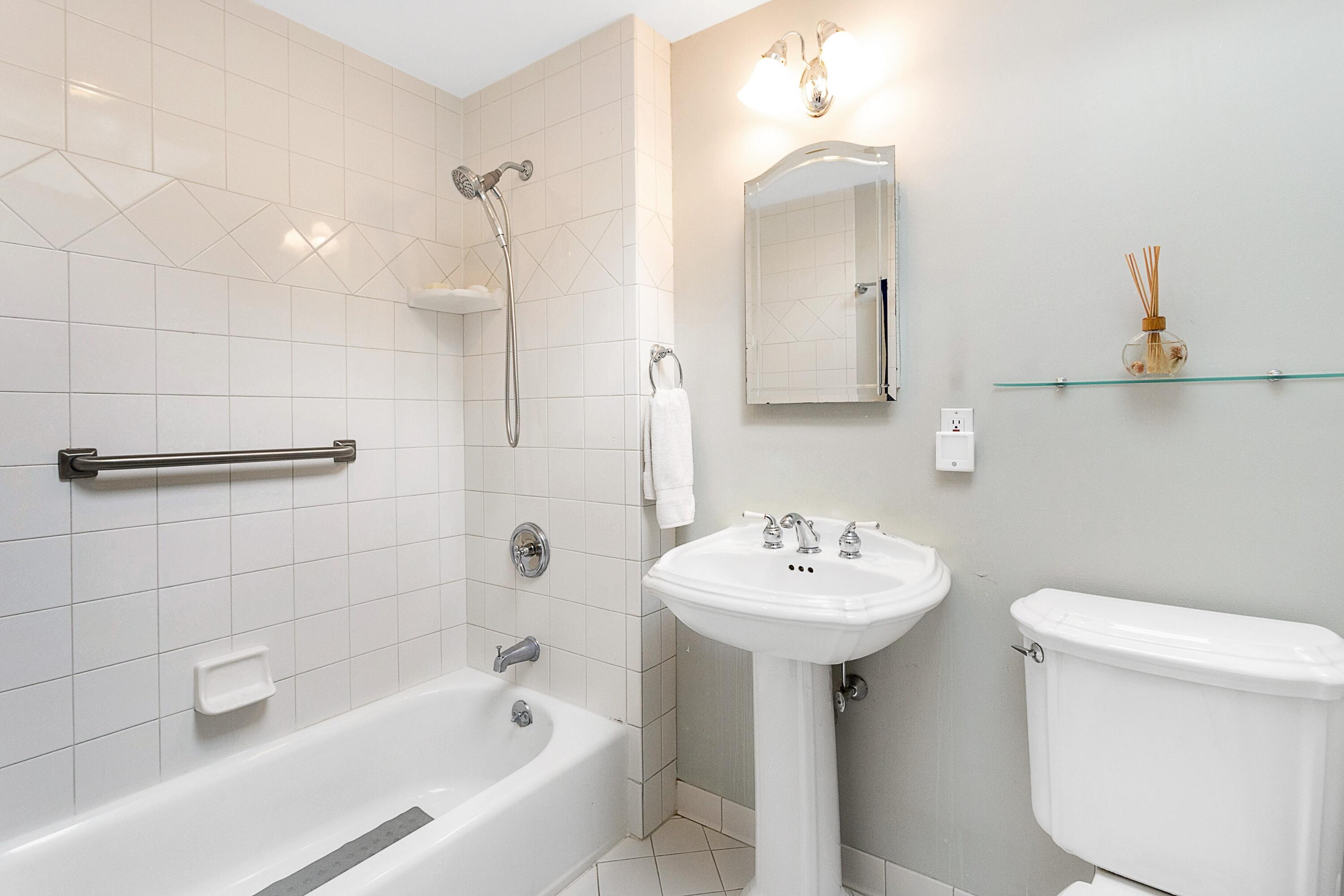 10 Wilson Ridge Road East Darien, CT 06820 - Photo 22 of 25 a bathroom with a sink a toilet and shower