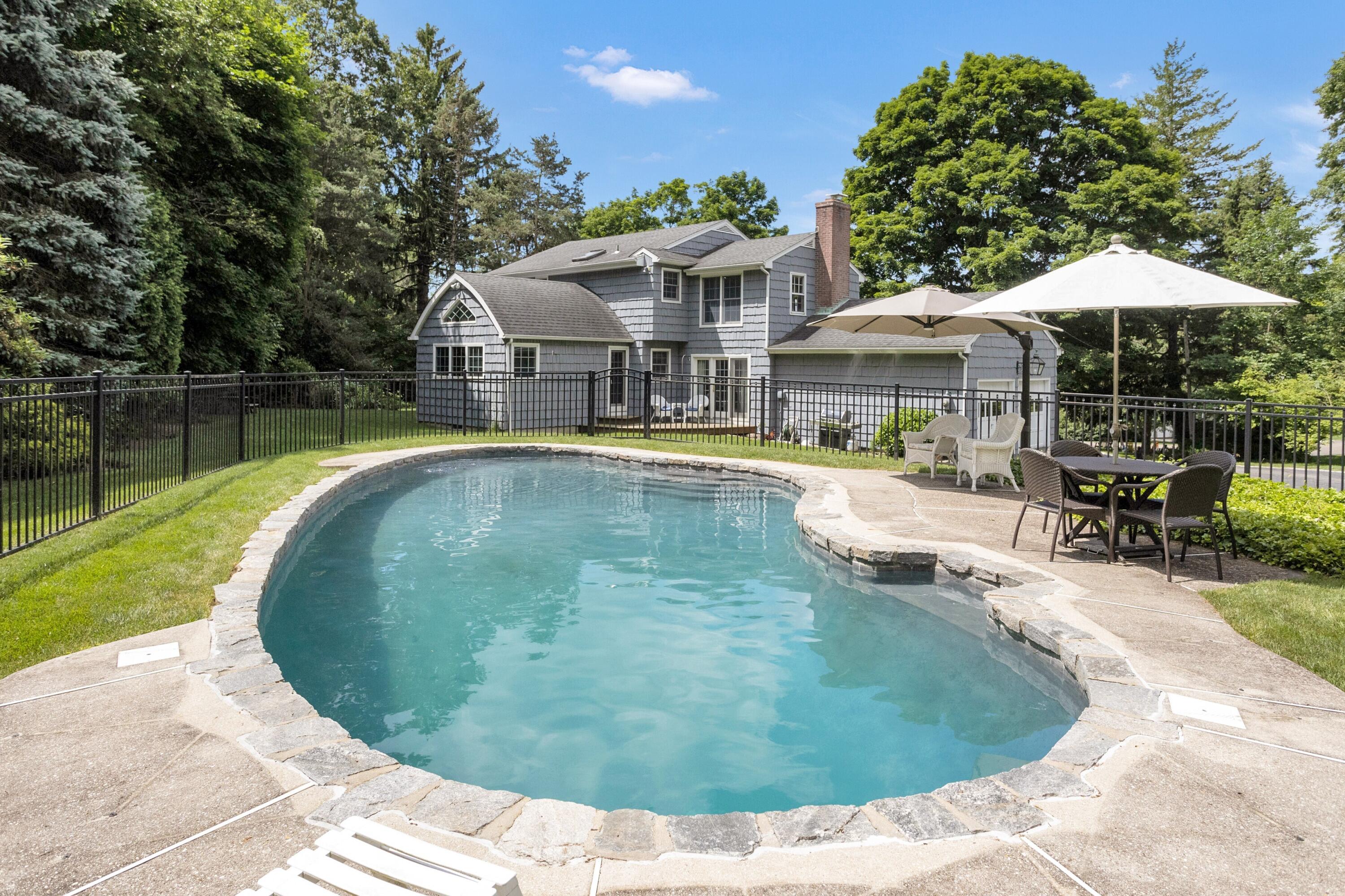 10 Wilson Ridge Road East Darien, CT 06820 - Photo 3 of 25 a swimming pool with outdoor seating yard and barbeque oven